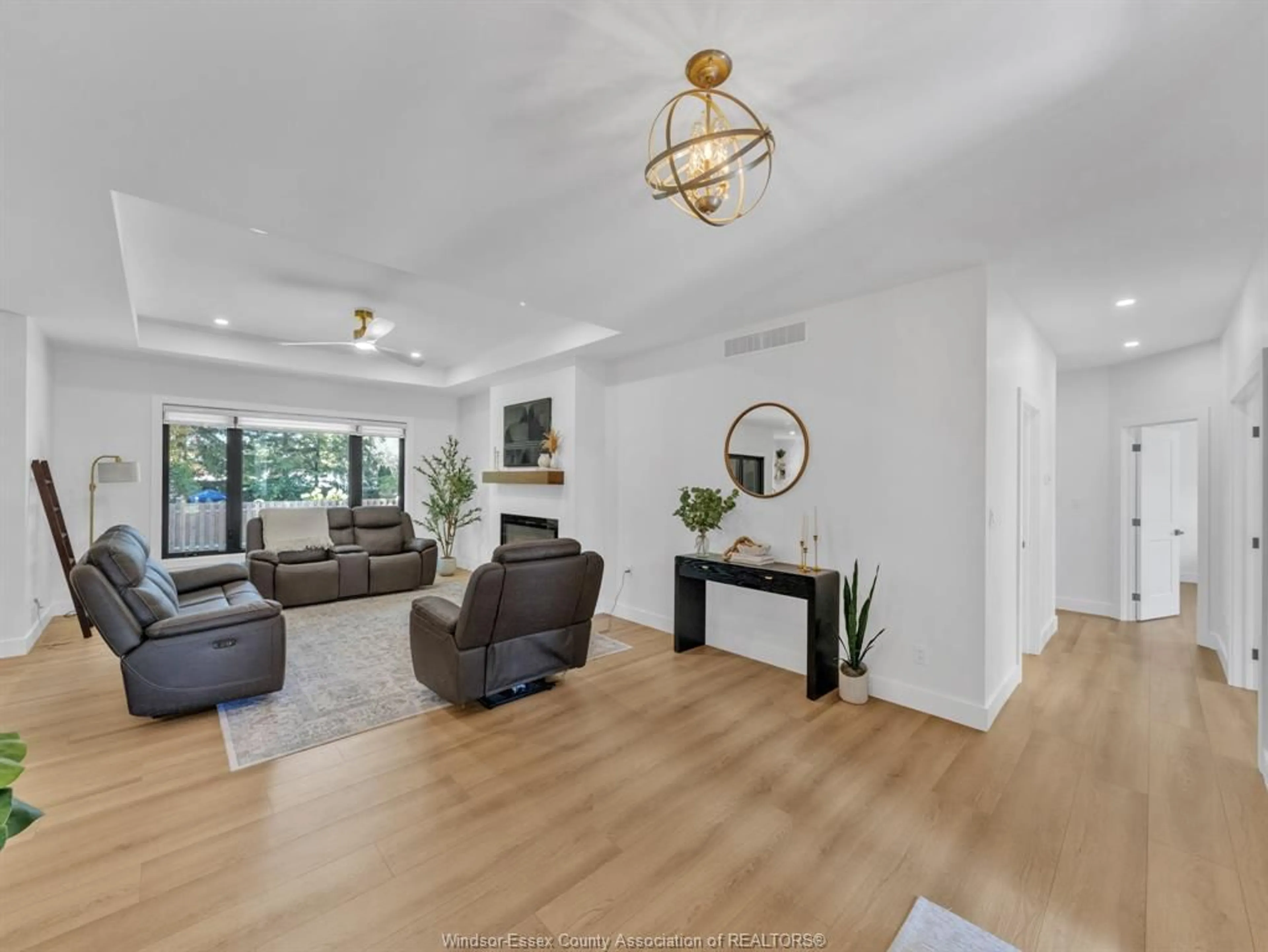 Living room with furniture, wood/laminate floor for 1499 FULLER Dr, Kingsville Ontario N9Y 3M7