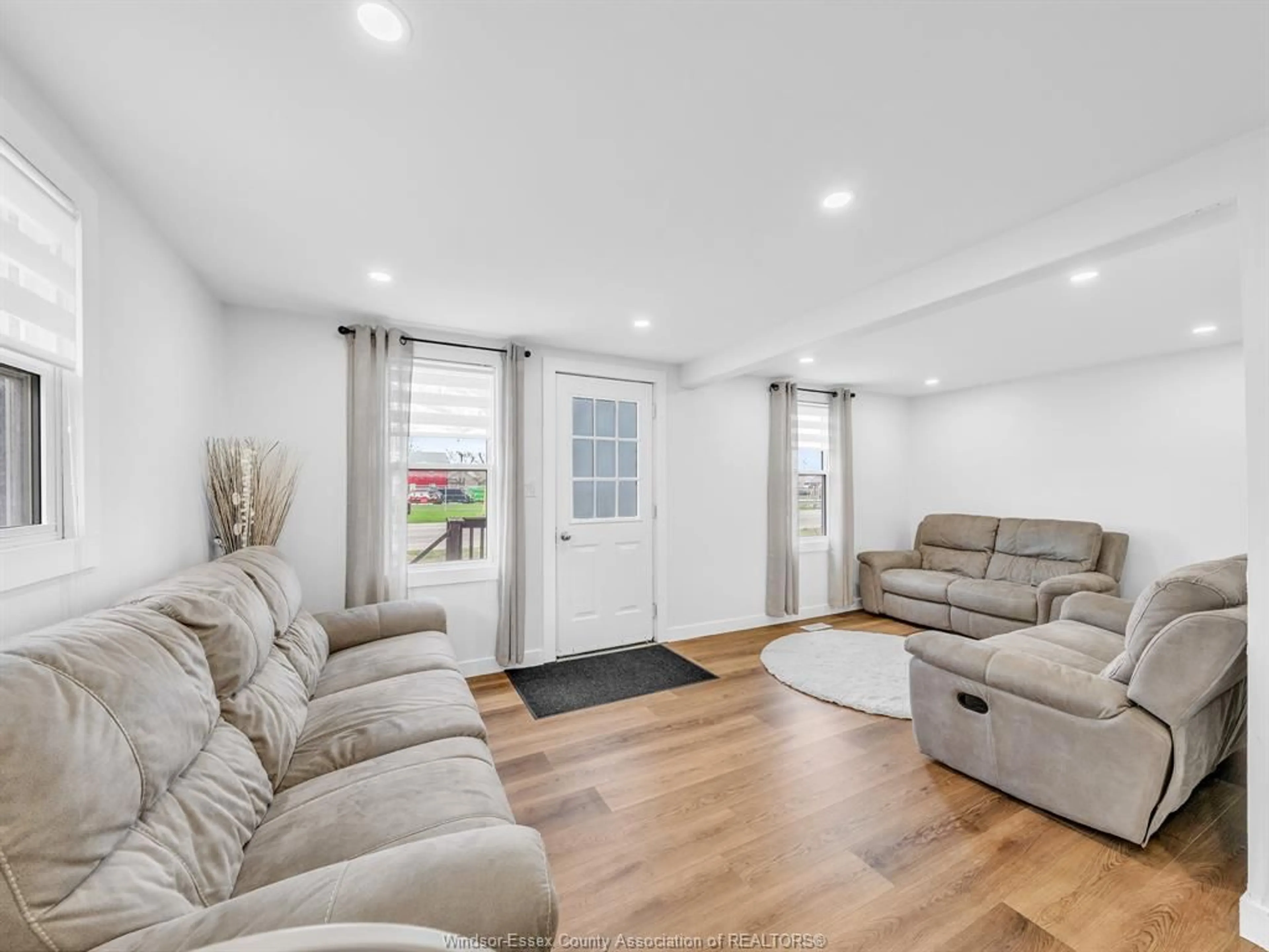 Living room with furniture, wood/laminate floor for 792 Highway 77, Leamington Ontario N8H 3V8