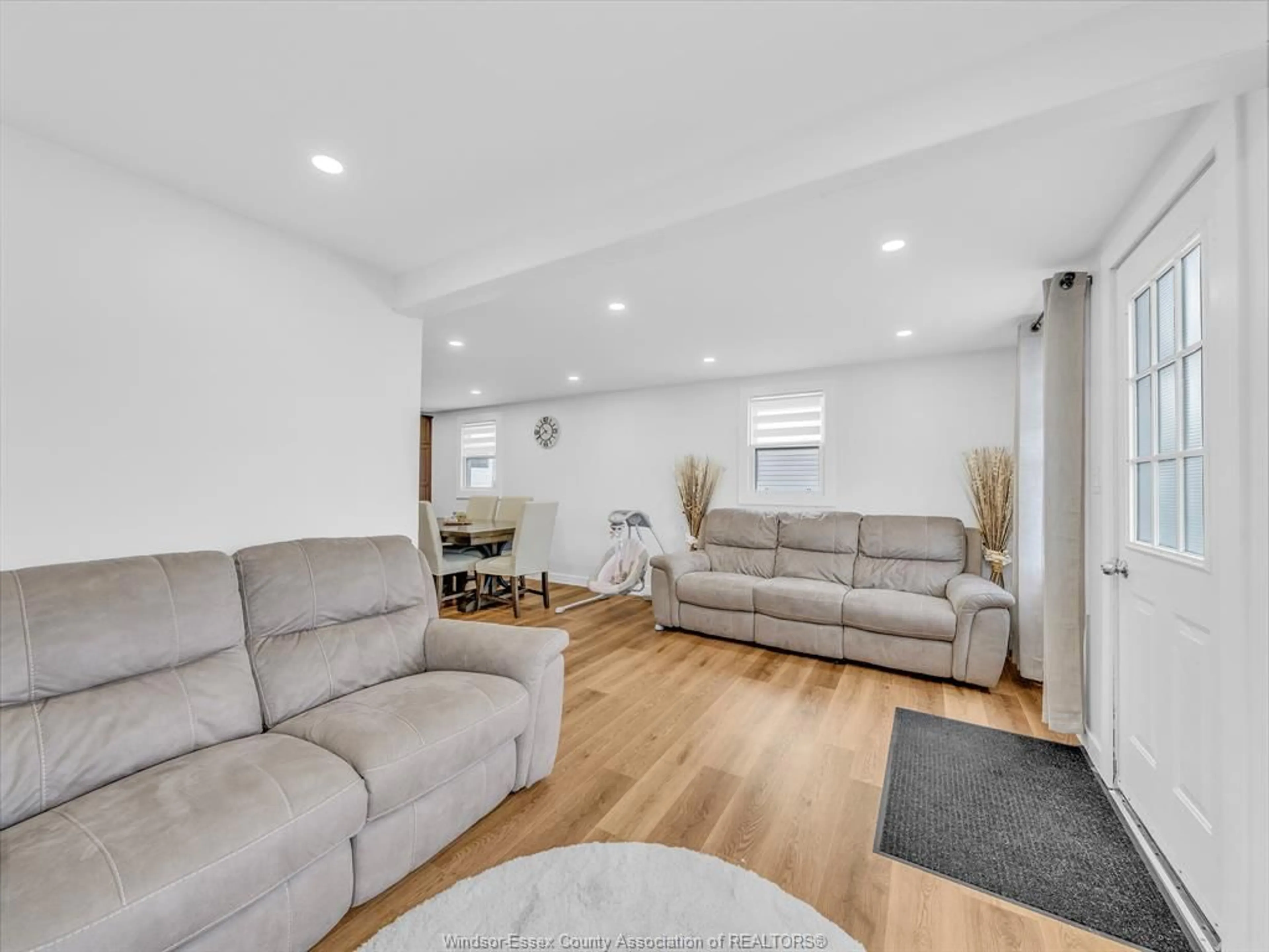 Living room with furniture, wood/laminate floor for 792 Highway 77, Leamington Ontario N8H 3V8