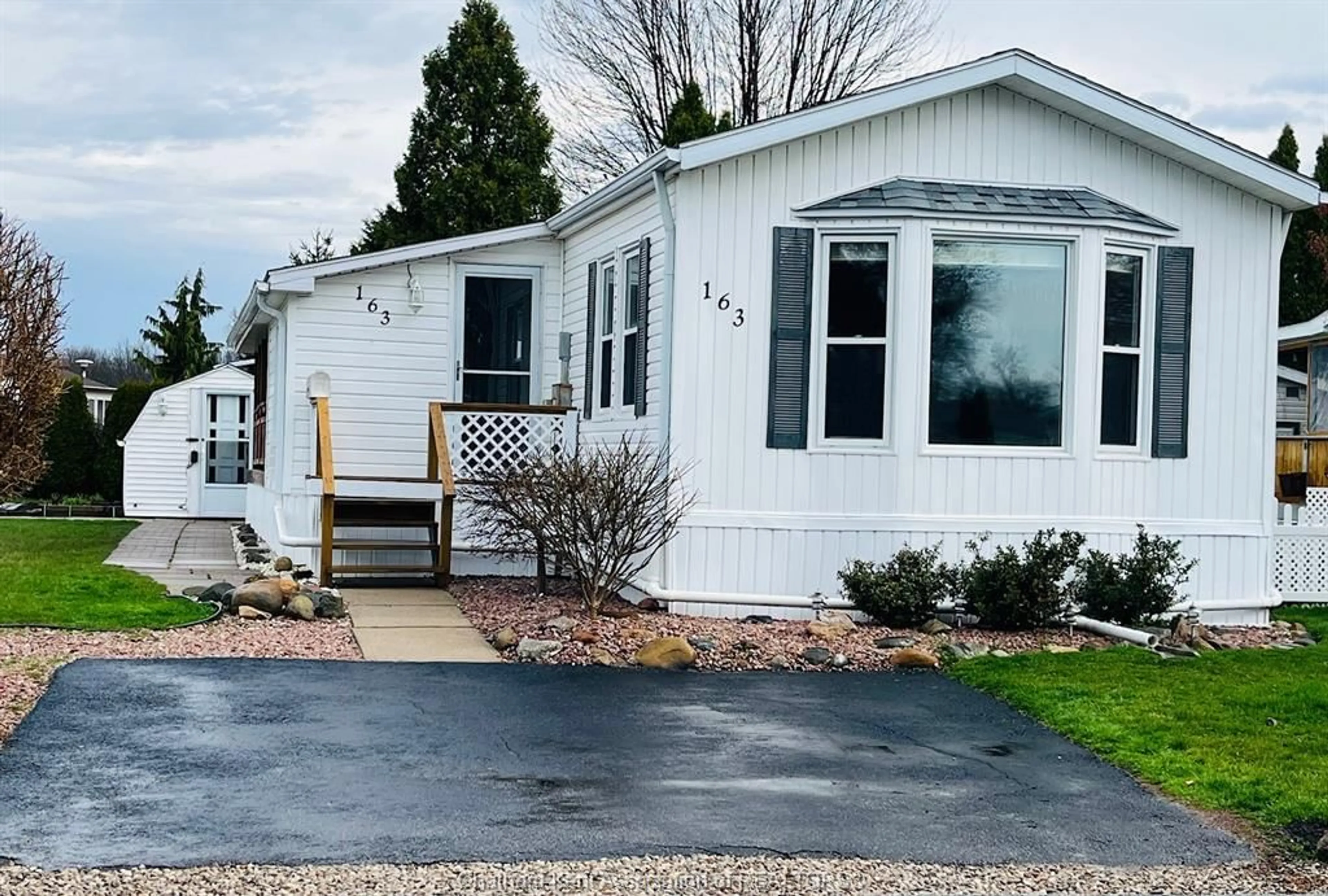 Home with vinyl exterior material, street for 163 Regency Dr, Chatham Ontario N7L 5J7