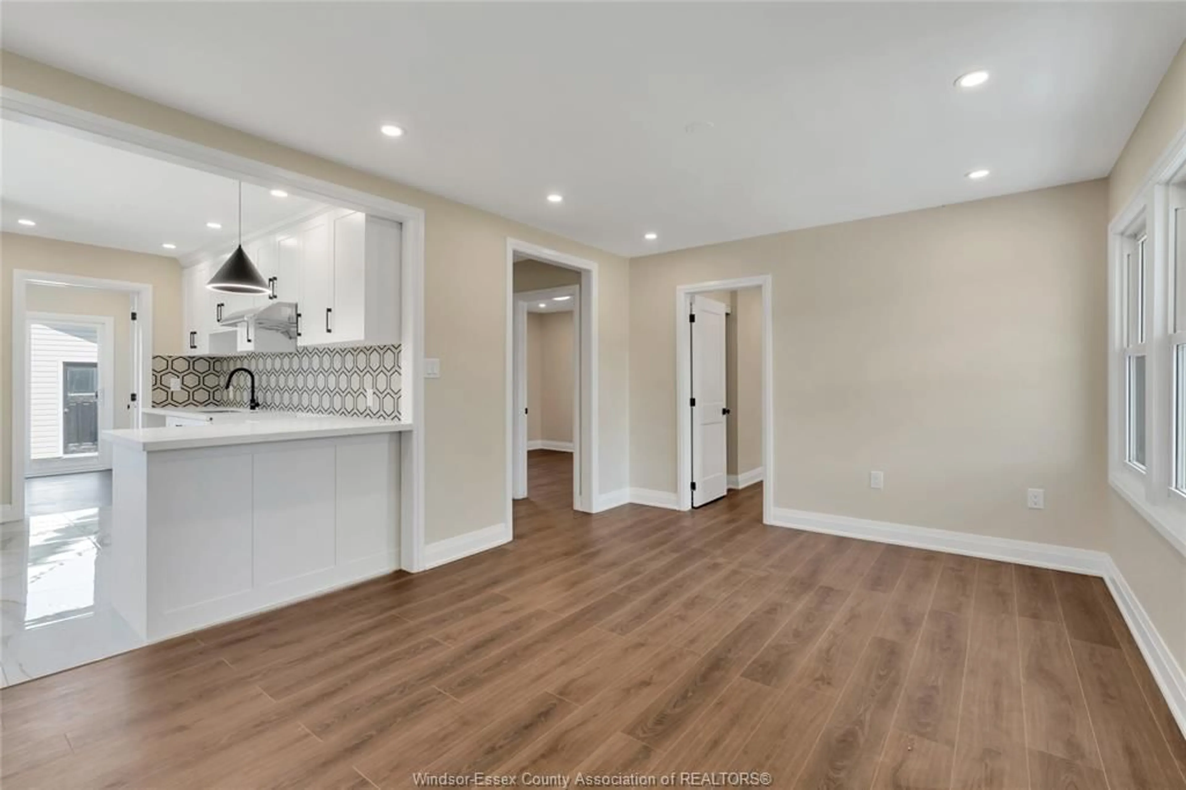 Open concept kitchen, wood/laminate floor for 1164 PARTINGTON Ave, Windsor Ontario N9B 2P4