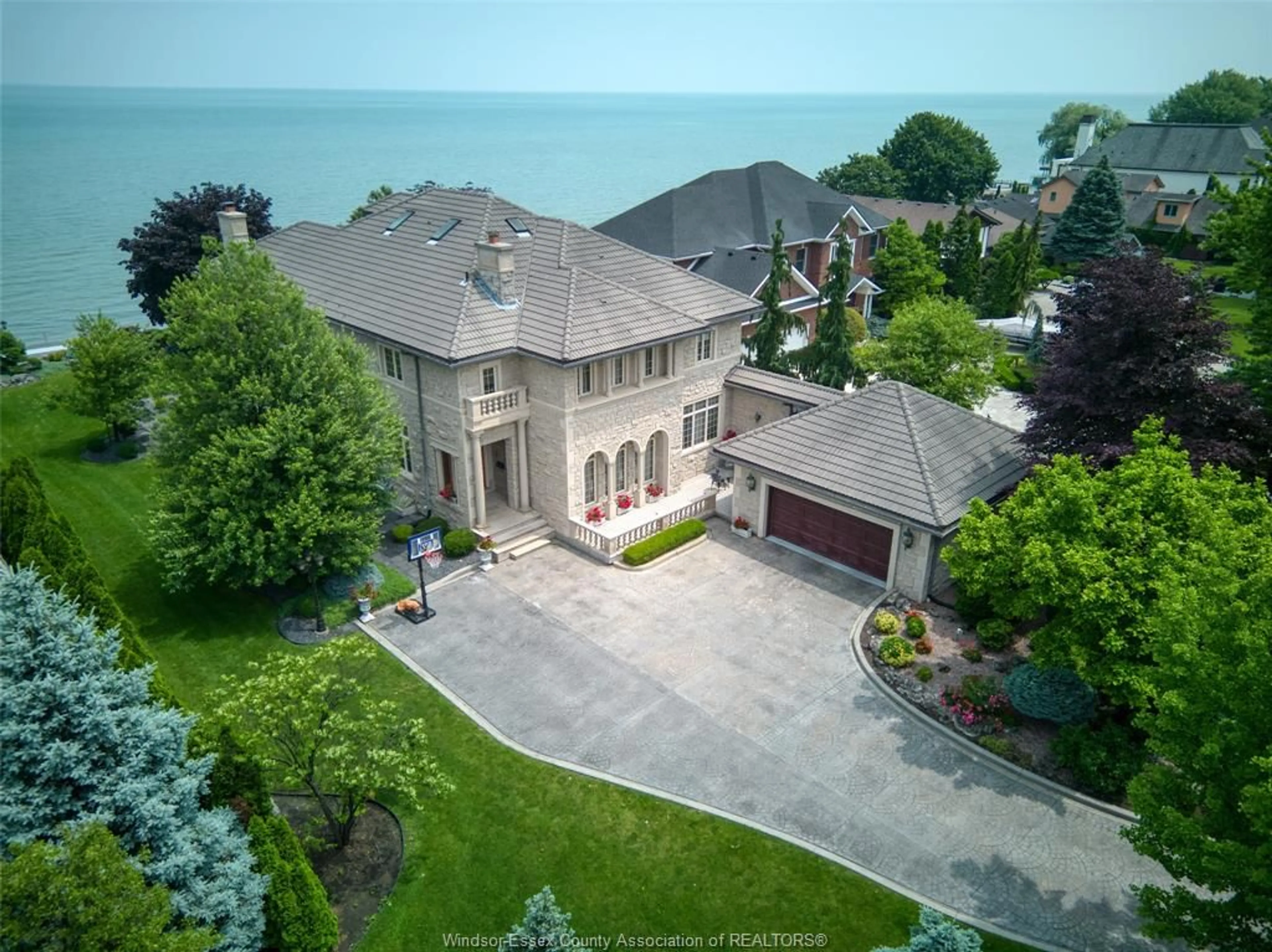 A pic from outside/outdoor area/front of a property/back of a property/a pic from drone, water/lake/river/ocean view for 300 Elmgrove Dr, Lakeshore Ontario N8N 3S4