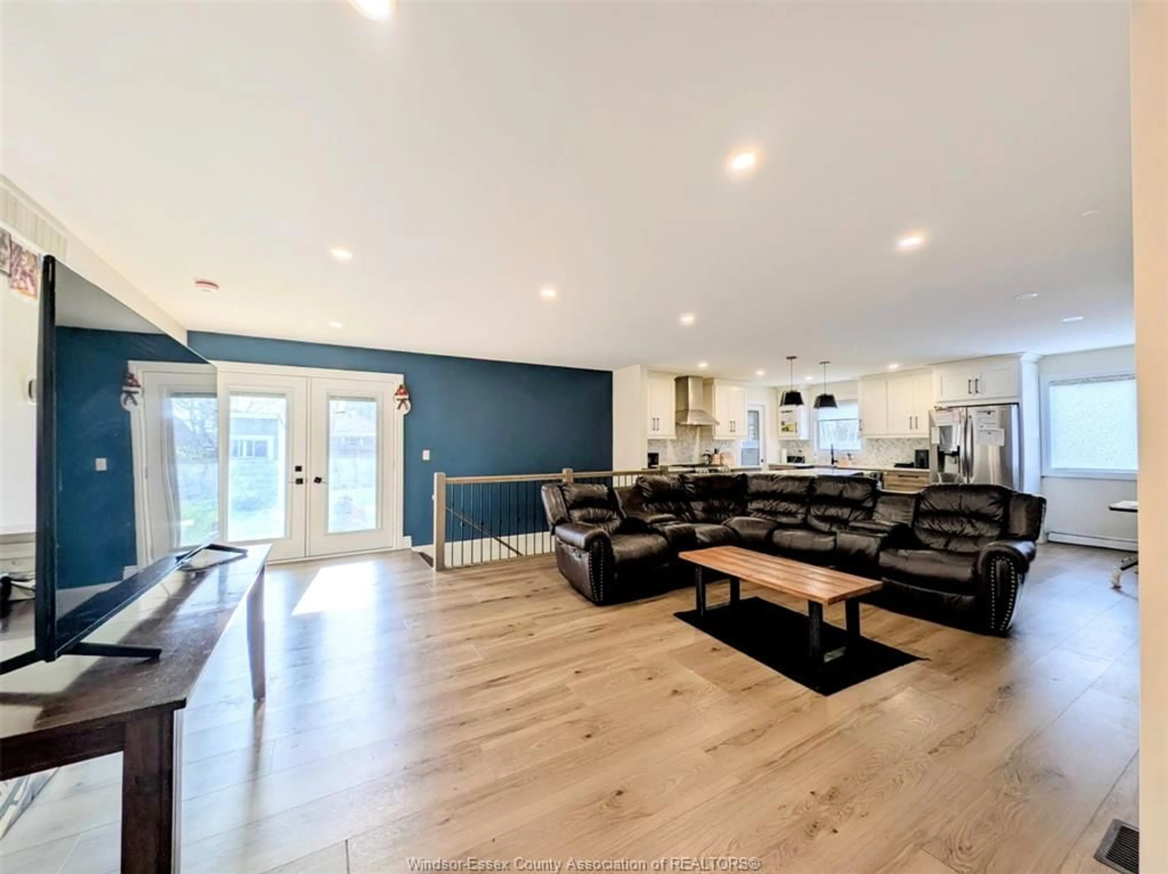 Living room with furniture, wood/laminate floor for 3617 TURNER Rd, Windsor Ontario N8W 3M9