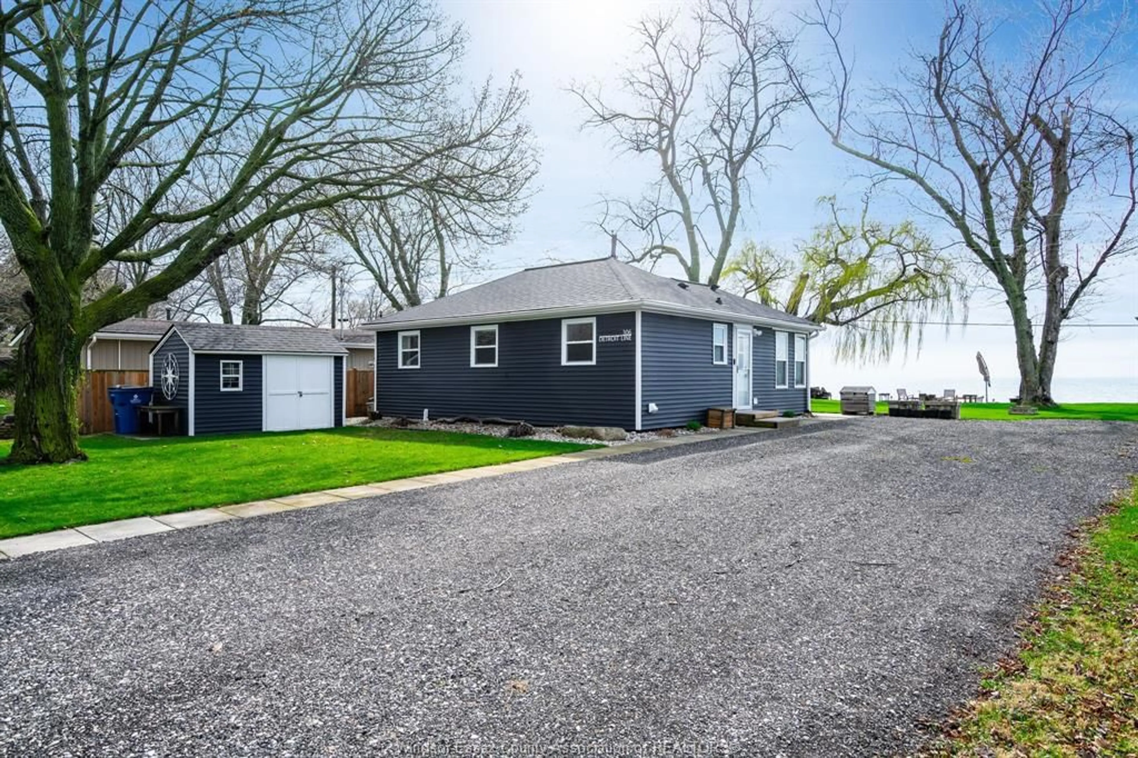 Home with vinyl exterior material, street for 306 Detroit Line, Wheatley Ontario N0P 2P0