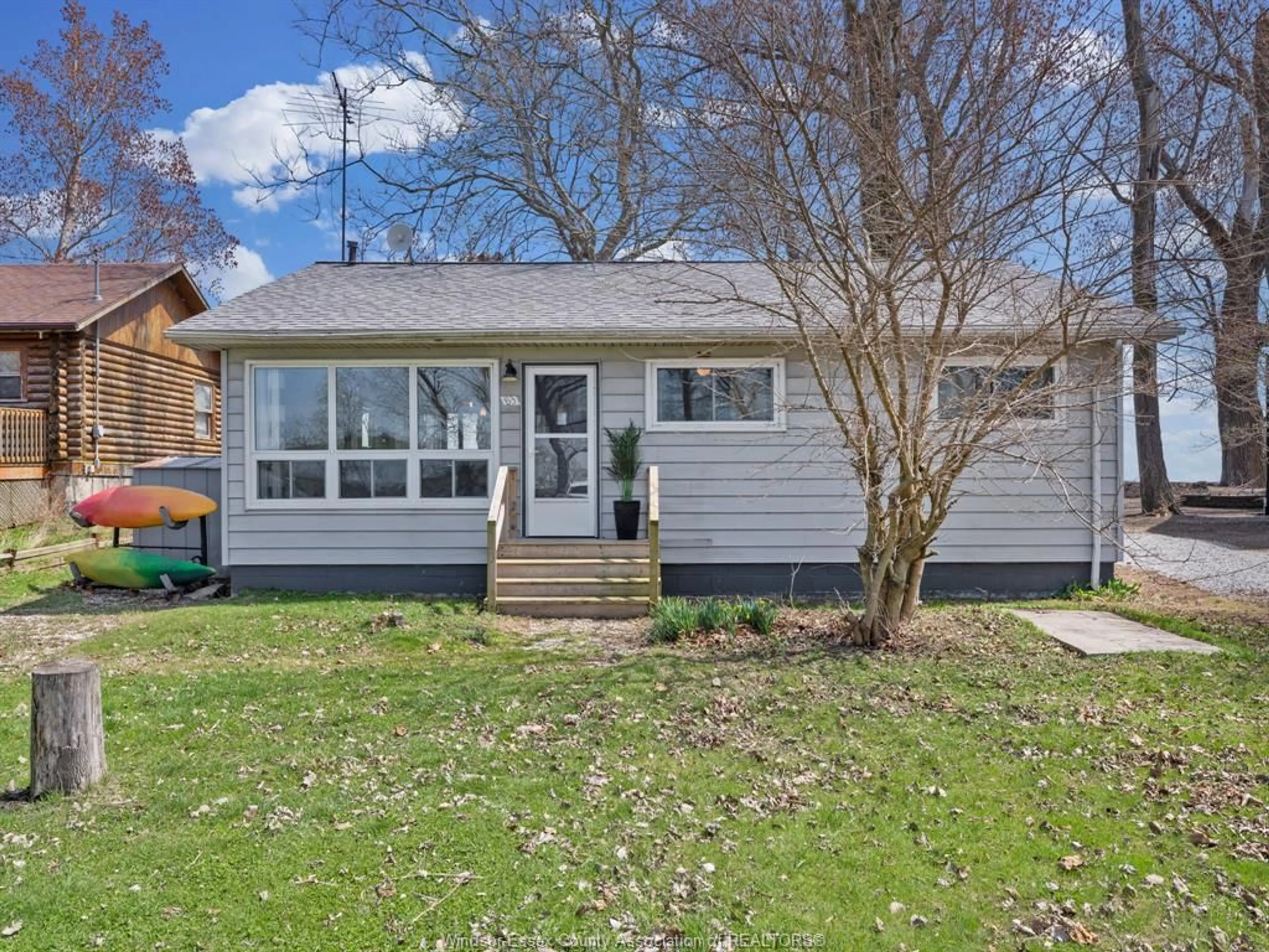 Home with vinyl exterior material, street for 83 Marentette Beach Dr, Leamington Ontario N8H 3V7