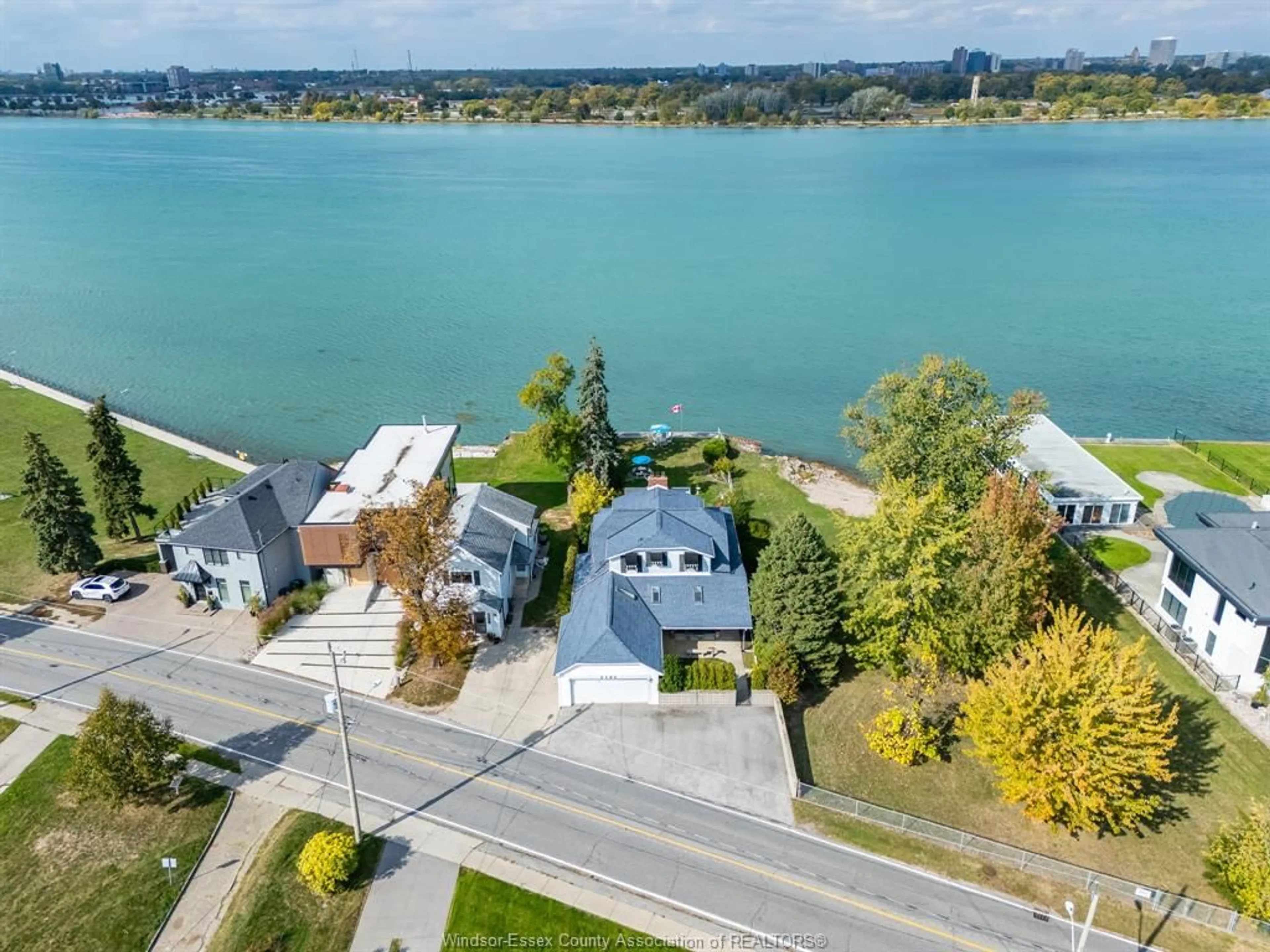 A pic from outside/outdoor area/front of a property/back of a property/a pic from drone, water/lake/river/ocean view for 4182 Riverside Dr, Windsor Ontario N8Y 1B5