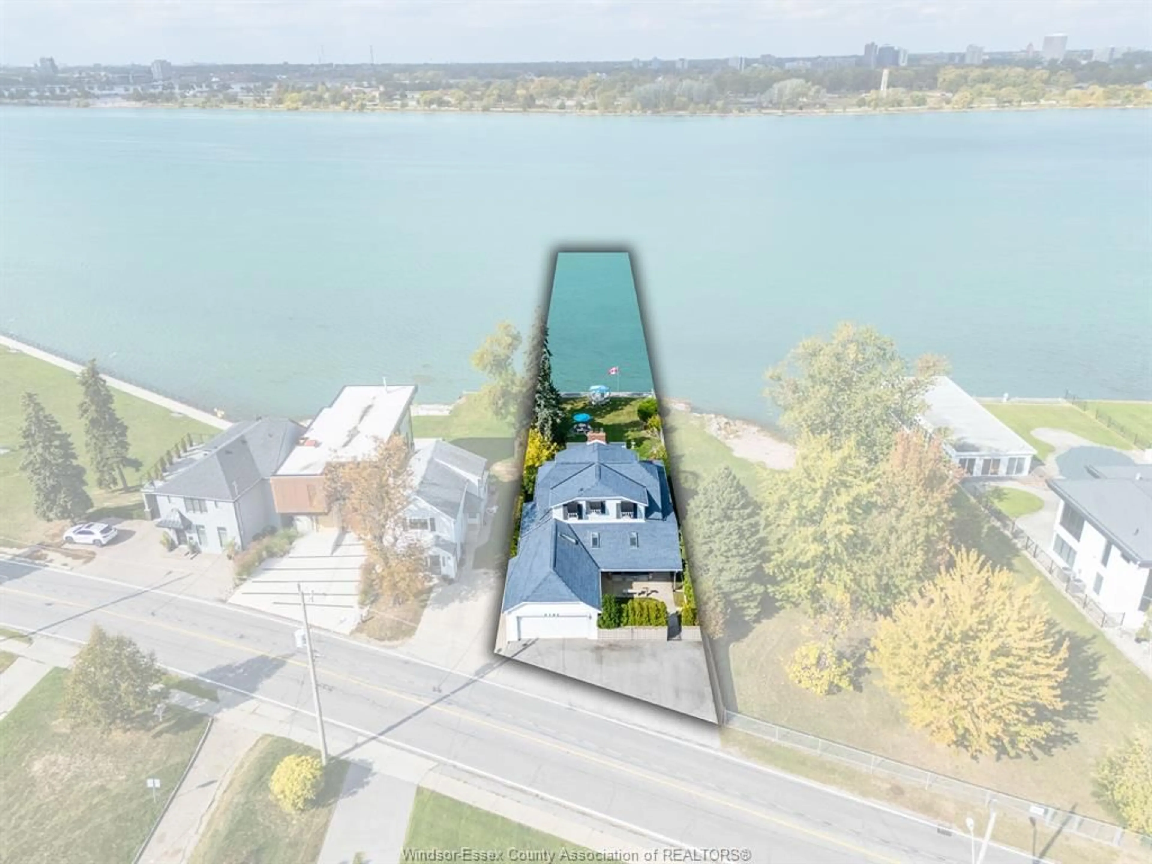 A pic from outside/outdoor area/front of a property/back of a property/a pic from drone, water/lake/river/ocean view for 4182 Riverside Dr, Windsor Ontario N8Y 1B5