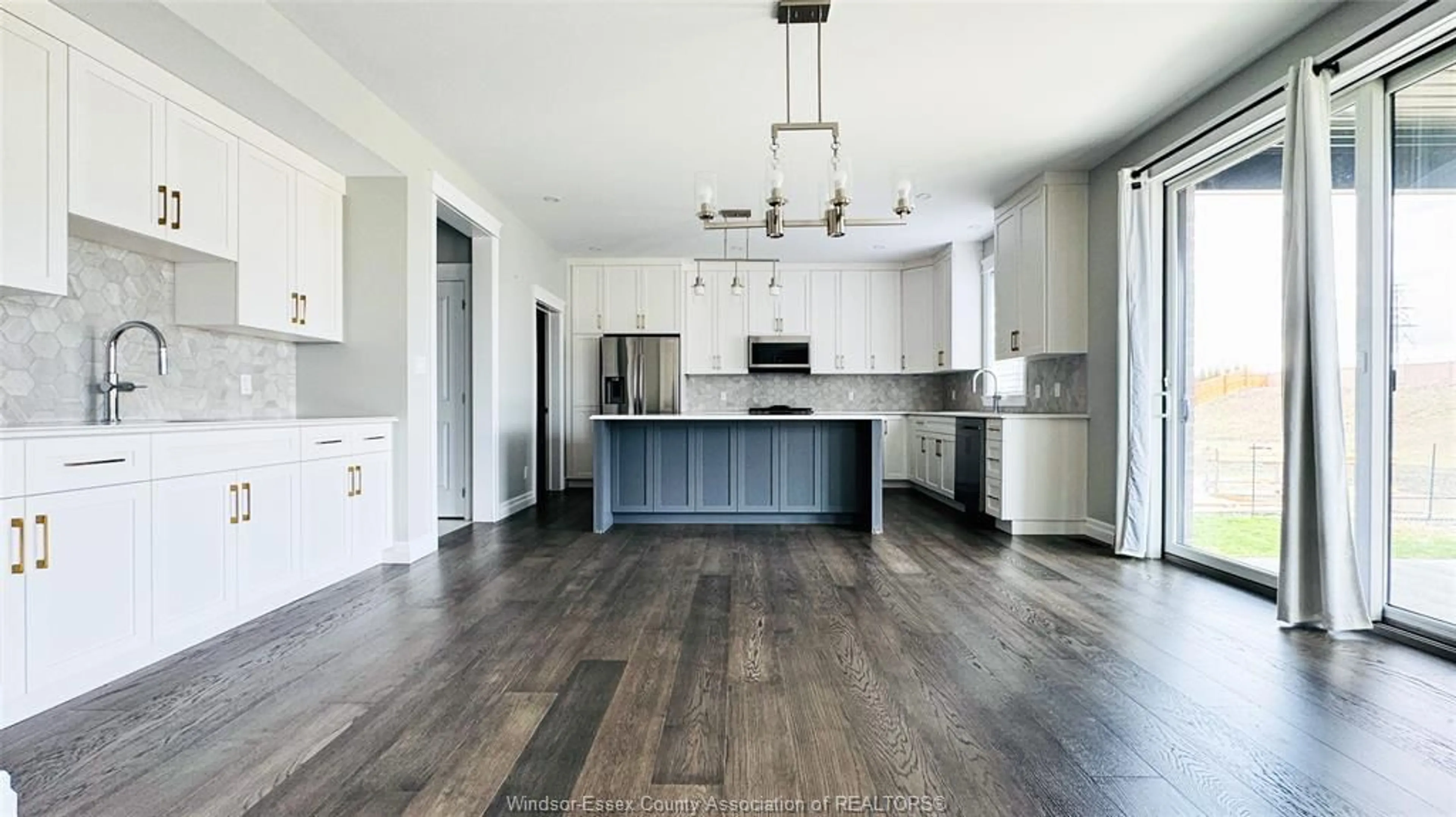 Open concept kitchen, wood/laminate floor for 310 BLAKE Ave, Belle River Ontario N8L 1B6