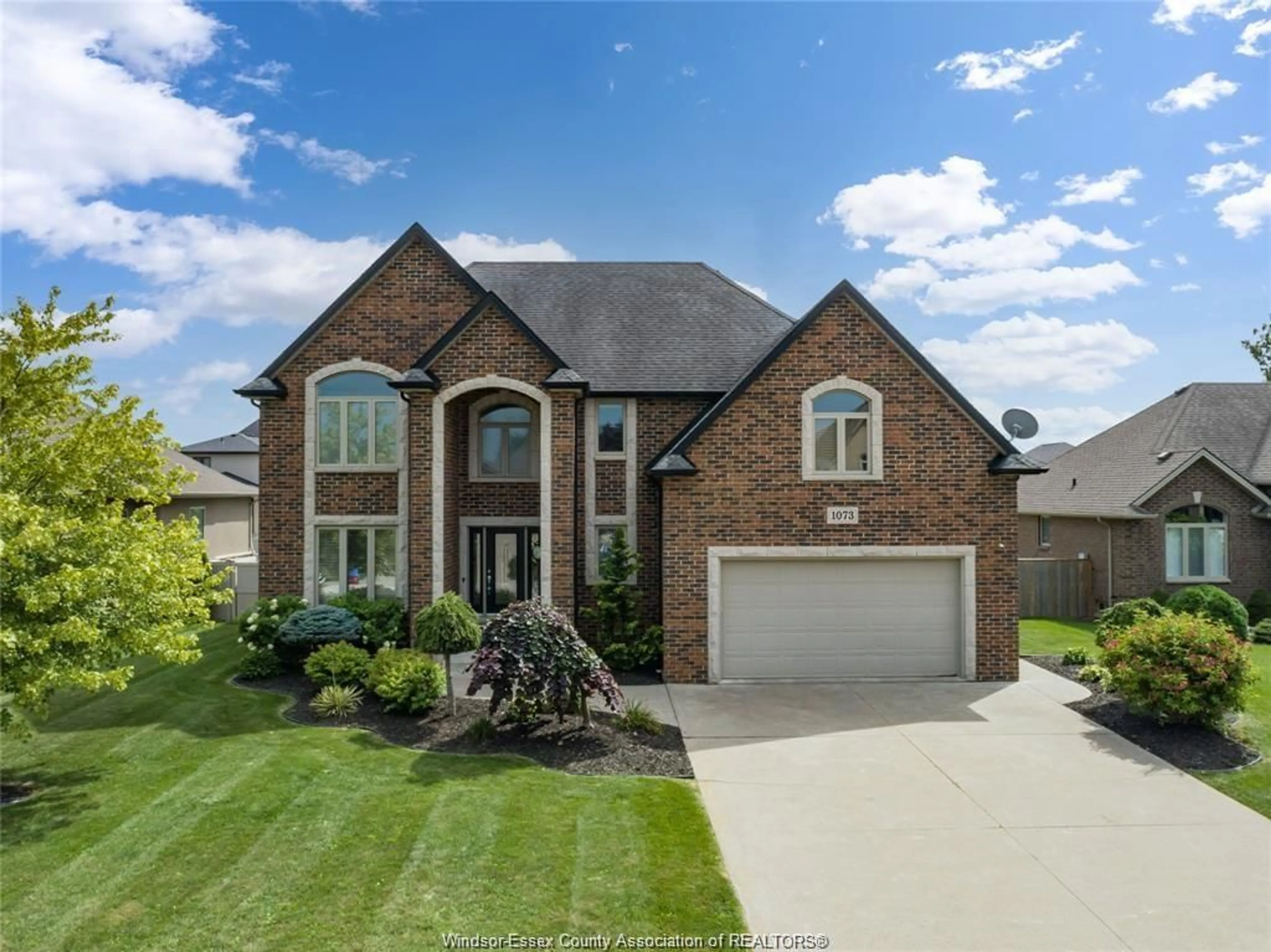 Home with brick exterior material, street for 1073 REGENCY Cres, Lakeshore Ontario N0R 1A0