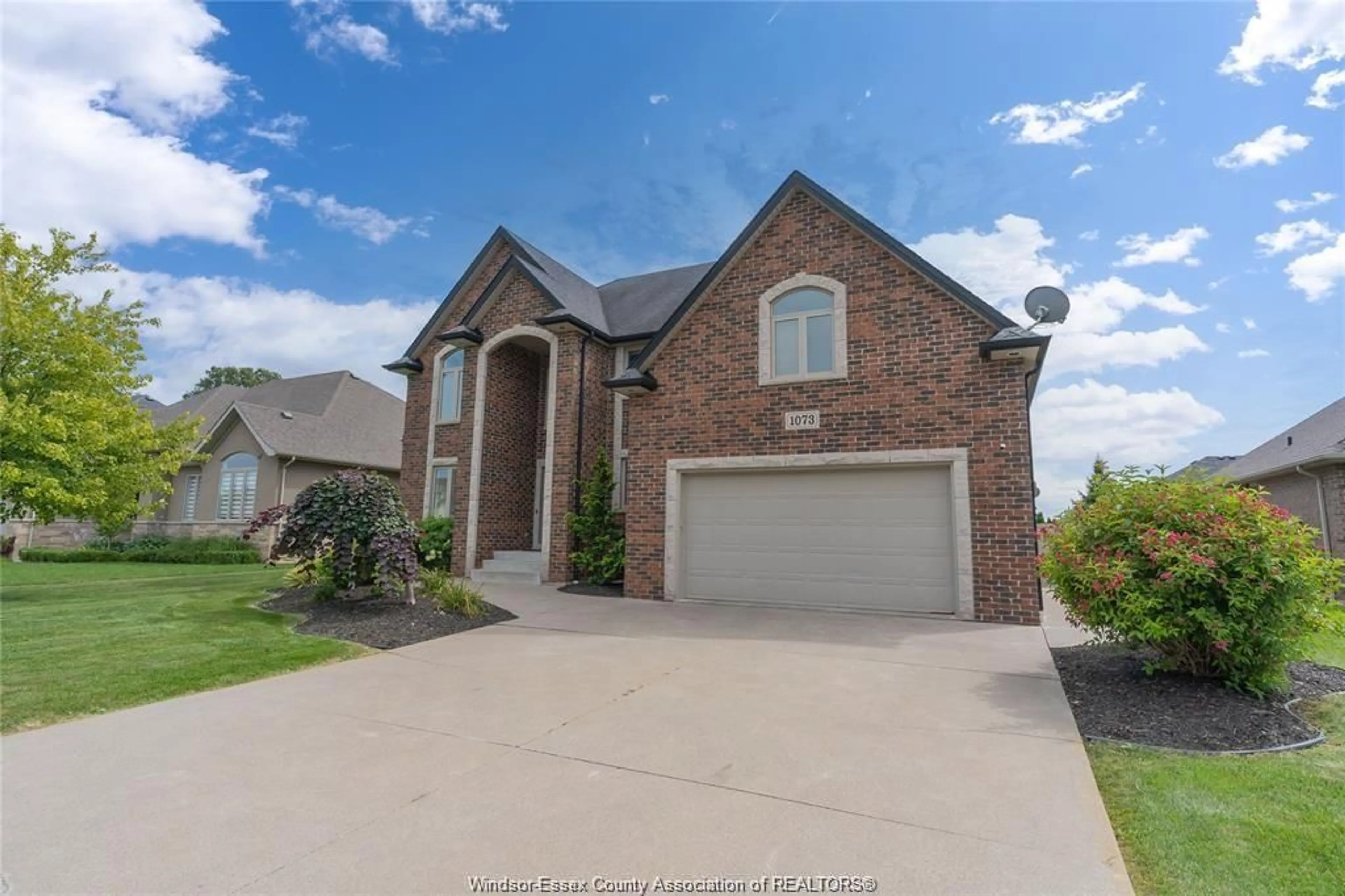 Home with brick exterior material, street for 1073 REGENCY Cres, Lakeshore Ontario N0R 1A0