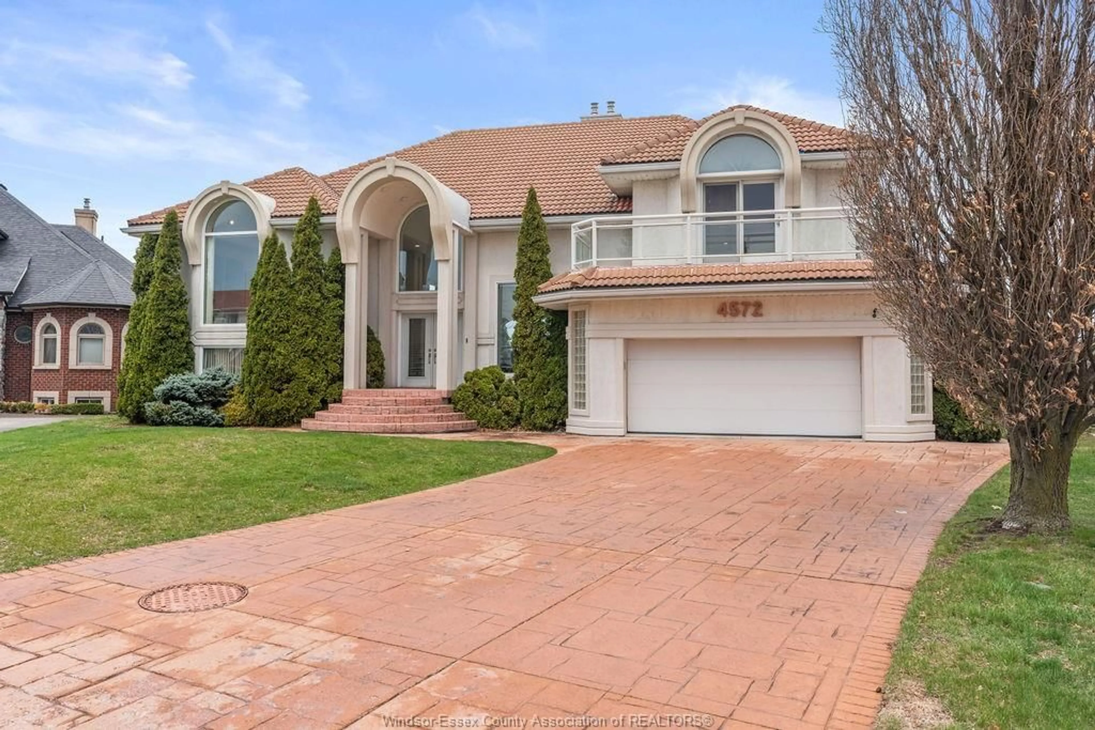 Home with brick exterior material, street for 4572 LAKE GRANDE Crt, Windsor Ontario N9G 2R3