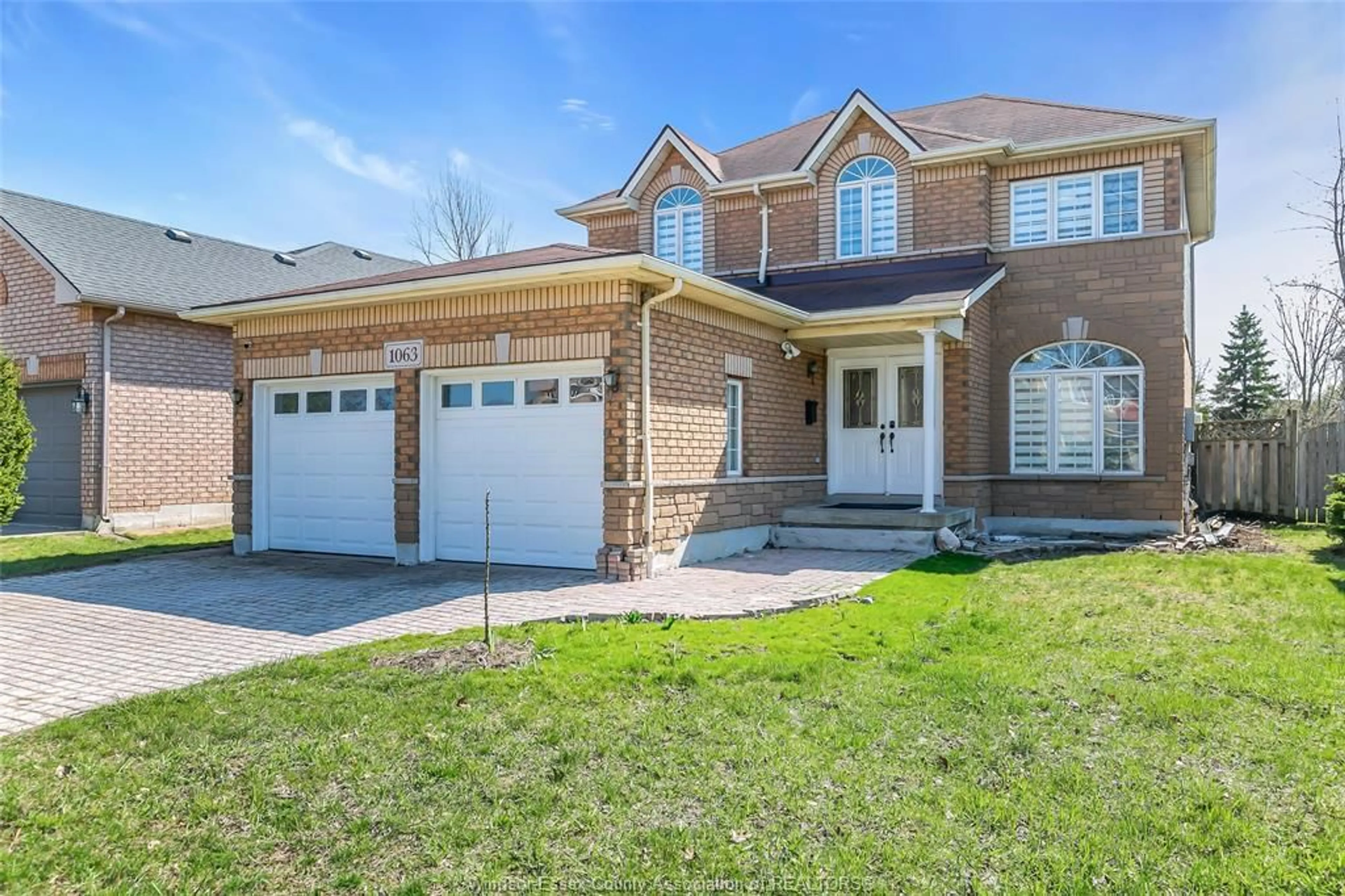 Home with brick exterior material, street for 1063 Peach Blossom Cres, Windsor Ontario N9G 2R5