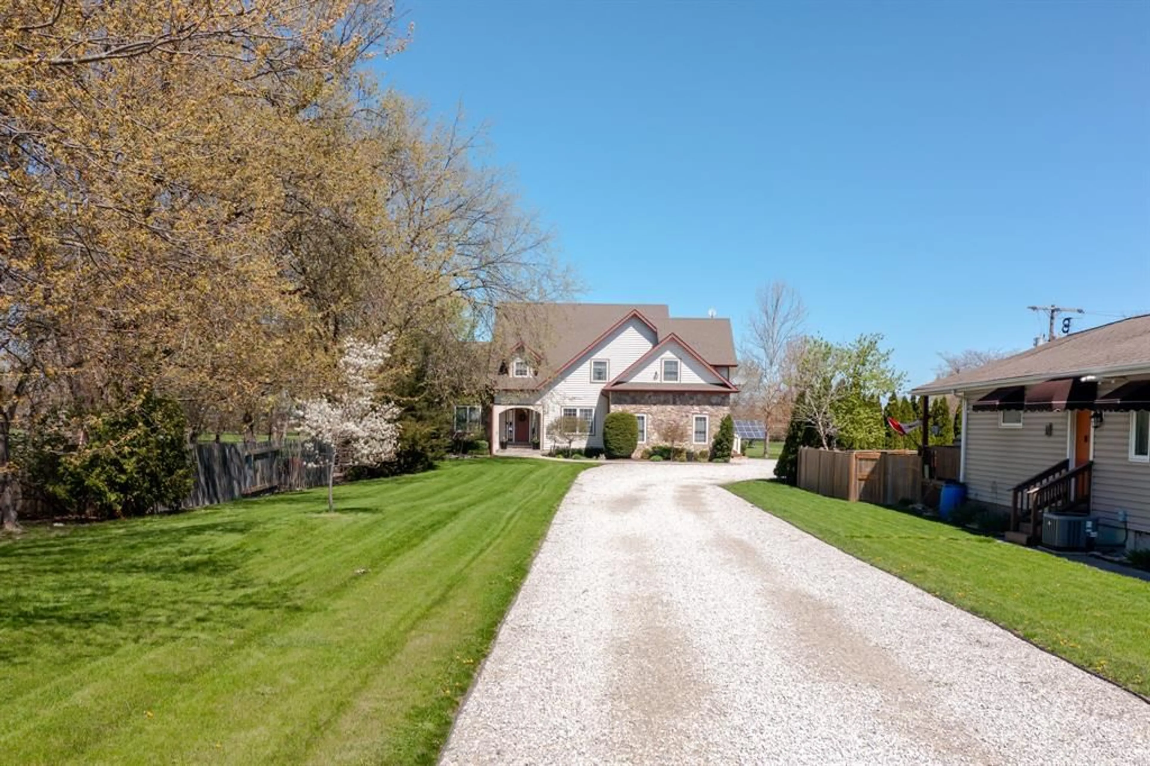 A pic from outside/outdoor area/front of a property/back of a property/a pic from drone, street for 1332 COUNTY 22 Rd, Lakeshore Ontario N0R 1A0