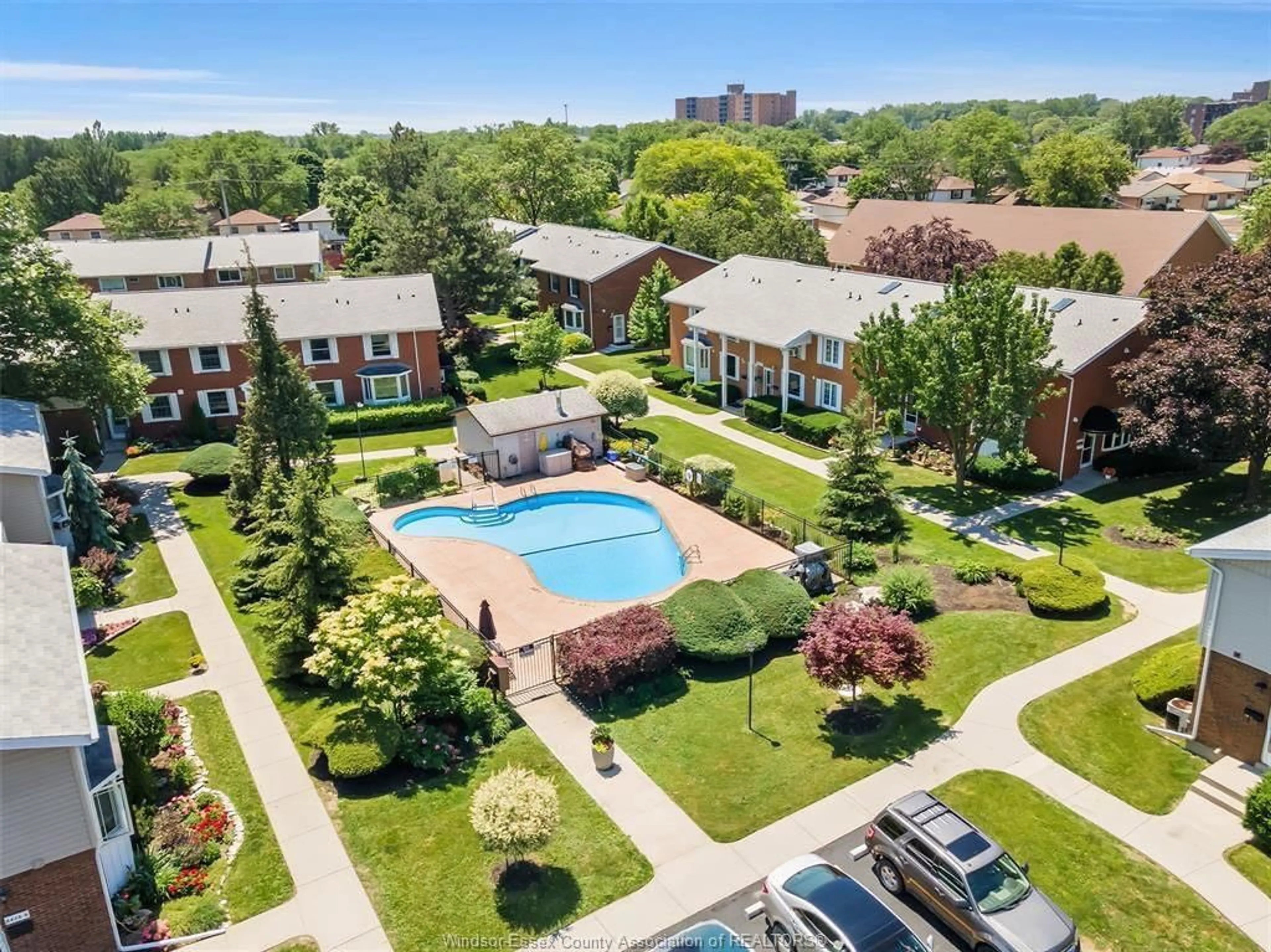 A pic from outside/outdoor area/front of a property/back of a property/a pic from drone, unknown for 8418 Little River Rd #5, Windsor Ontario N8S 2B5