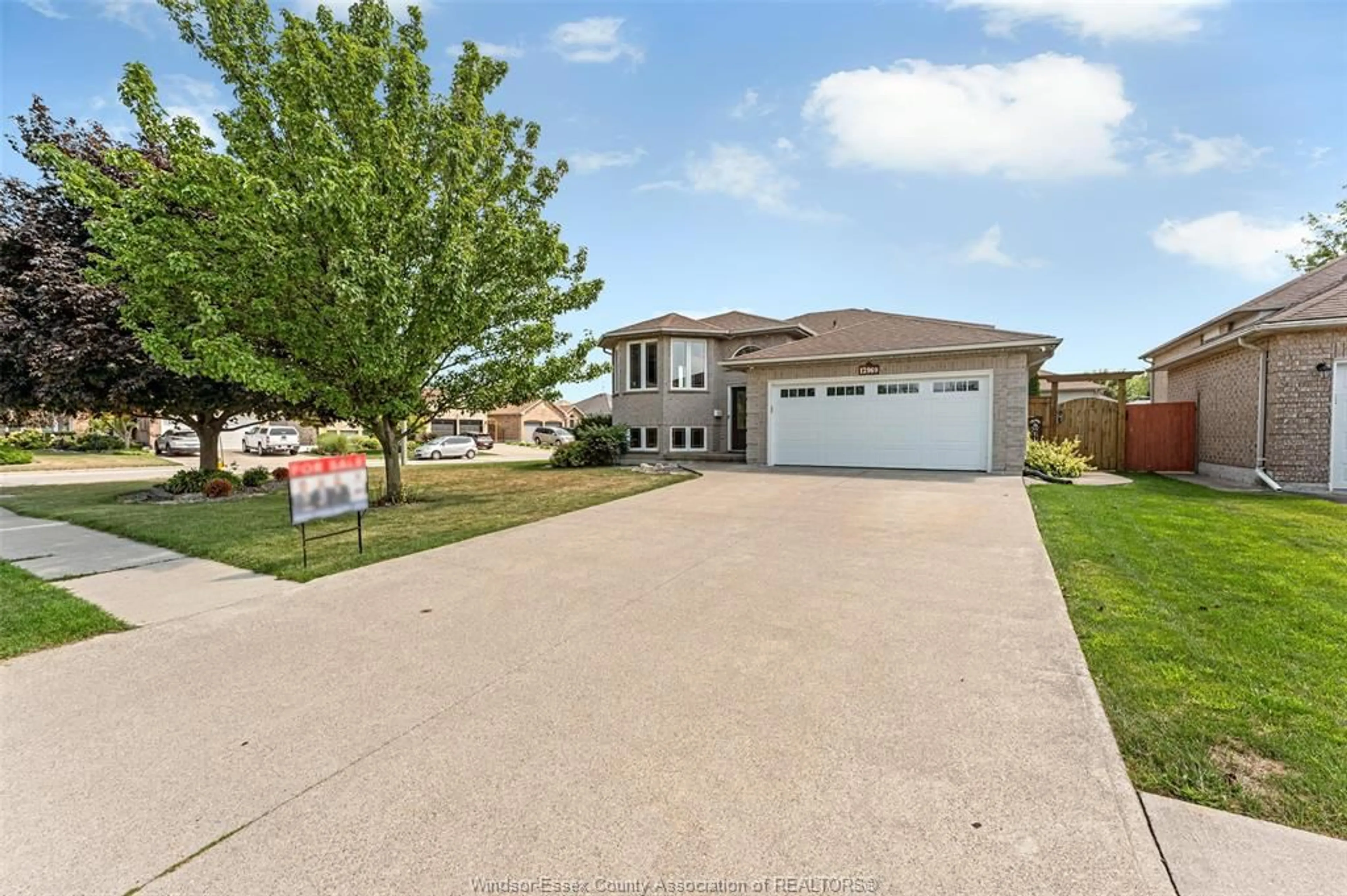 A pic from outside/outdoor area/front of a property/back of a property/a pic from drone, street for 12969 LANOUE St, Tecumseh Ontario N8N 5A7