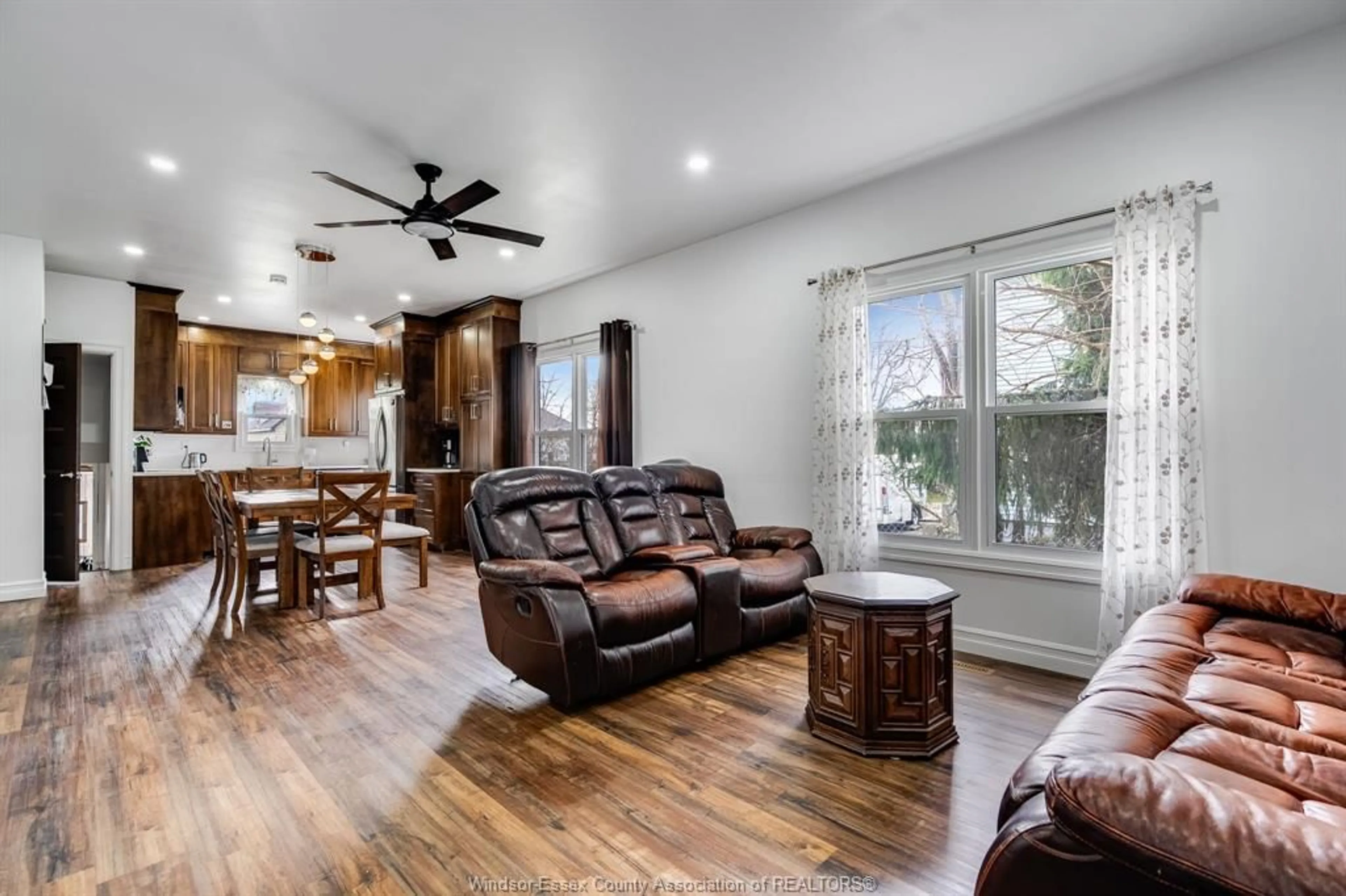 Living room with furniture, wood/laminate floor for 38 Fox St, Leamington Ontario N8H 3J4