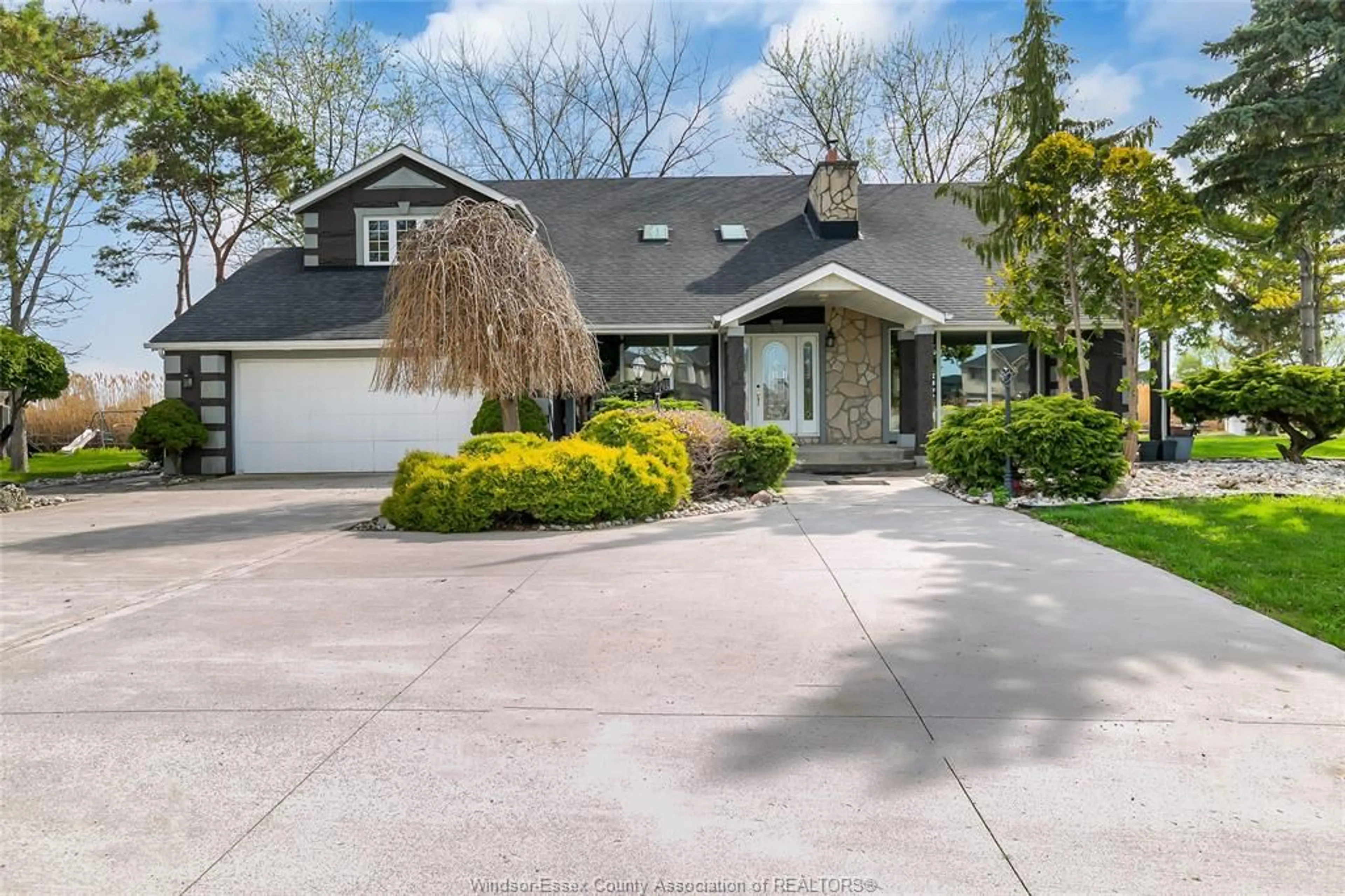 A pic from outside/outdoor area/front of a property/back of a property/a pic from drone, street for 112 COUNTY RD 22, Belle River Ontario N8L 1H8