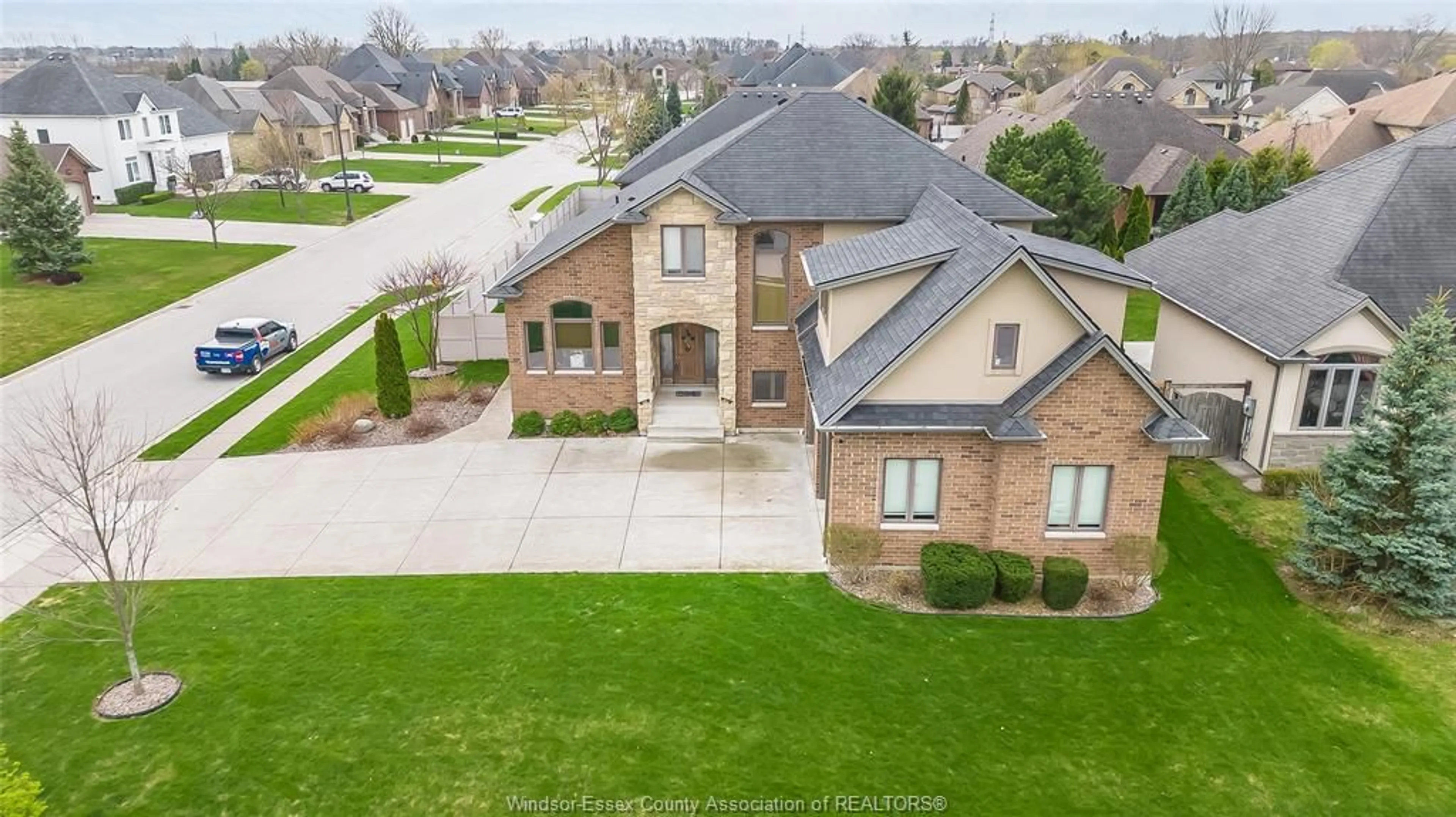 A pic from outside/outdoor area/front of a property/back of a property/a pic from drone, street for 12337 CANDLEWOOD Dr, Tecumseh Ontario N9K 0A3