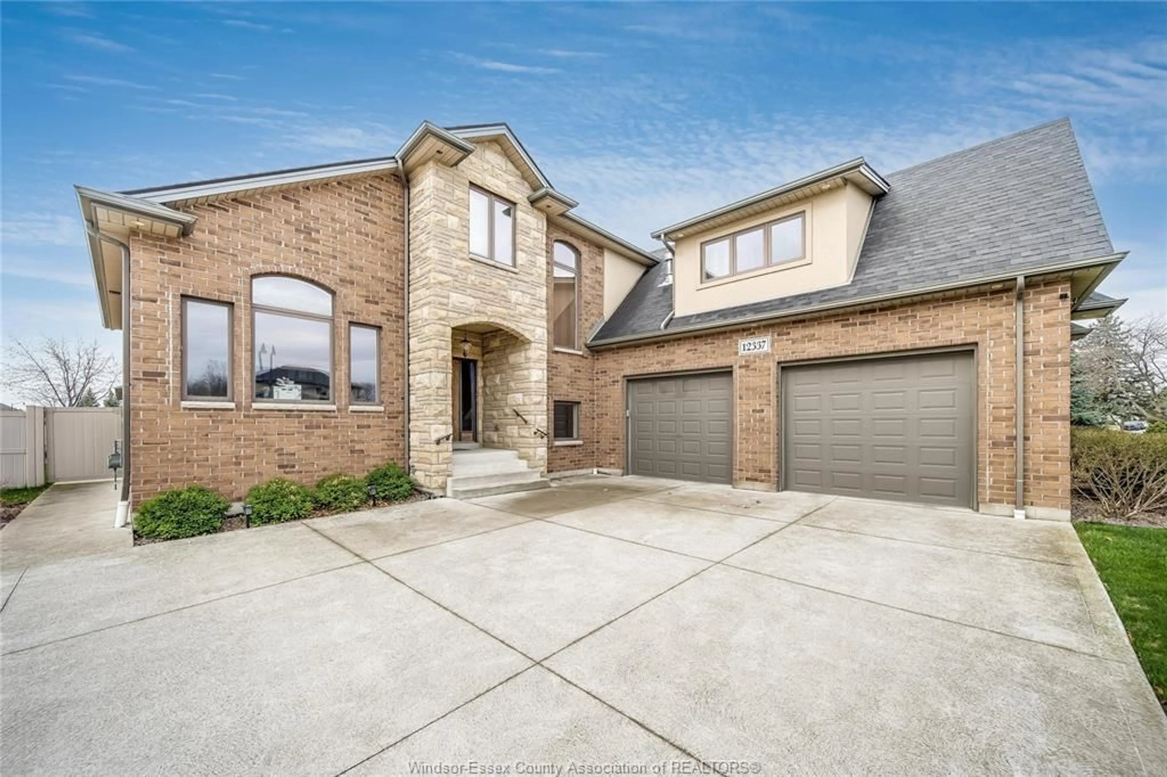 Home with brick exterior material, street for 12337 CANDLEWOOD Dr, Tecumseh Ontario N9K 0A3