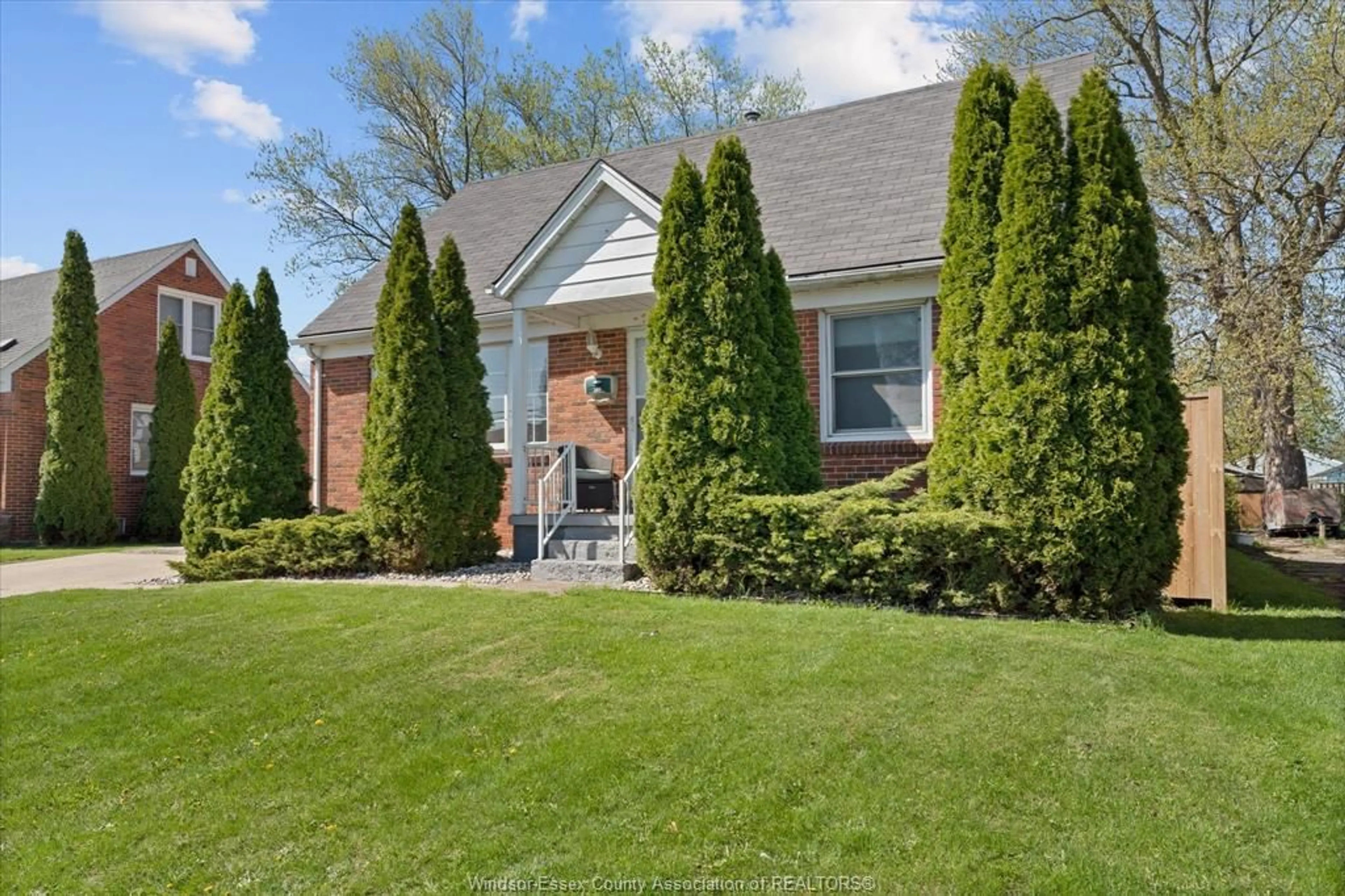 Home with brick exterior material, street for 341 LAUZON Rd, Windsor Ontario N8S 3M1