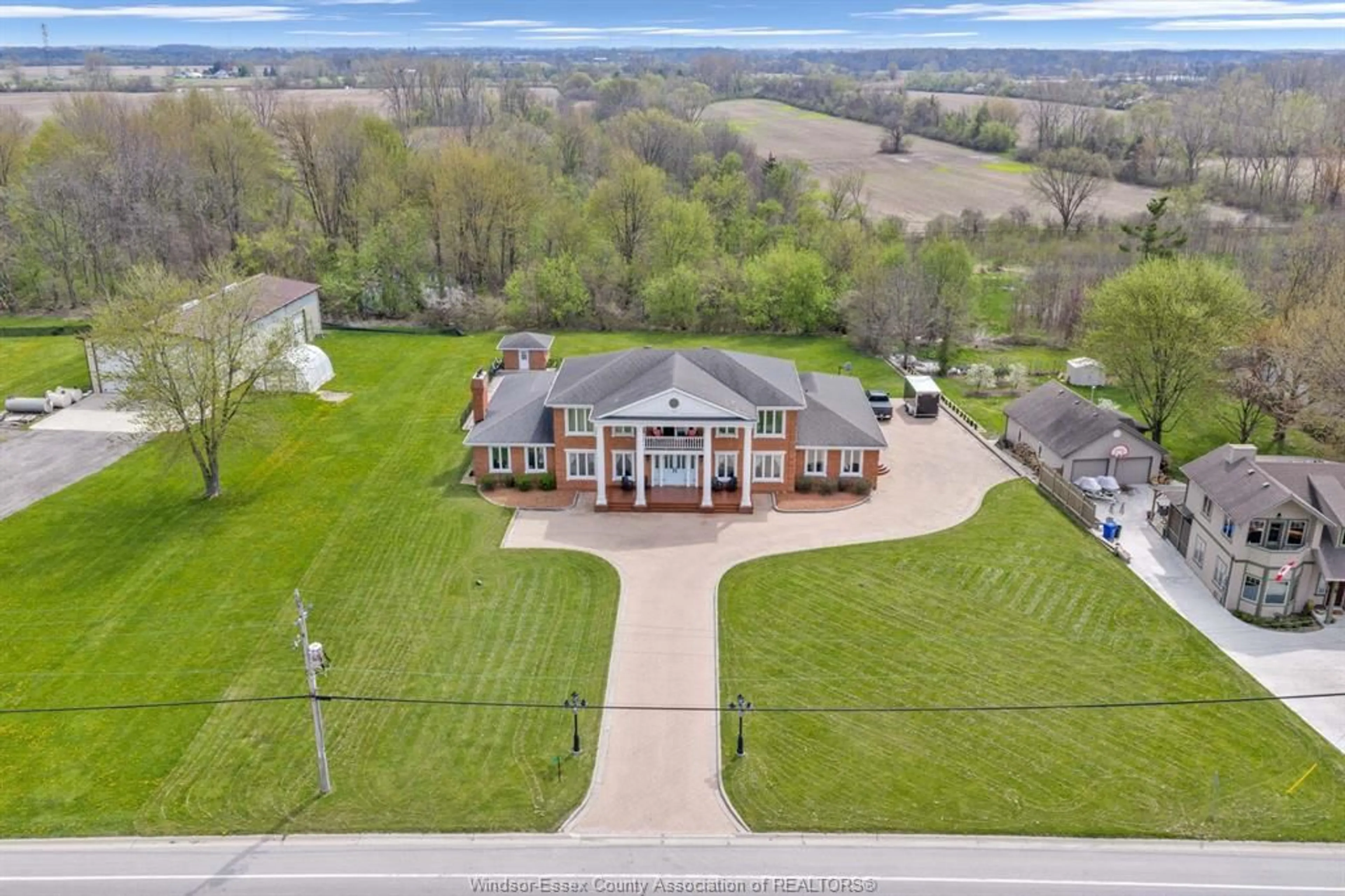 A pic from outside/outdoor area/front of a property/back of a property/a pic from drone, water/lake/river/ocean view for 883 Front Road South, Amherstburg Ontario N9V 2M4