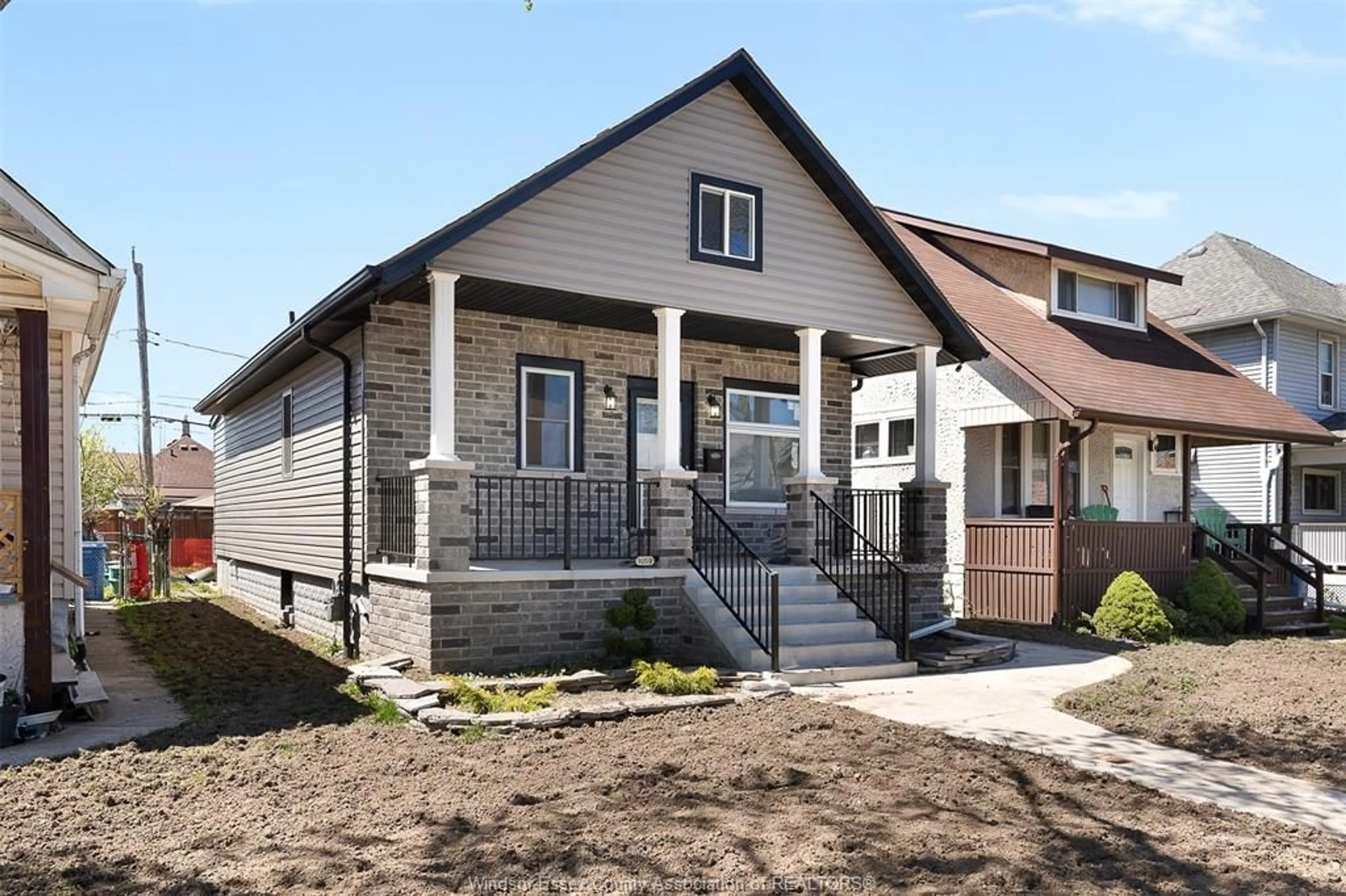 Home with brick exterior material, street for 1059 ELSMERE Ave, Windsor Ontario N9A 2B1