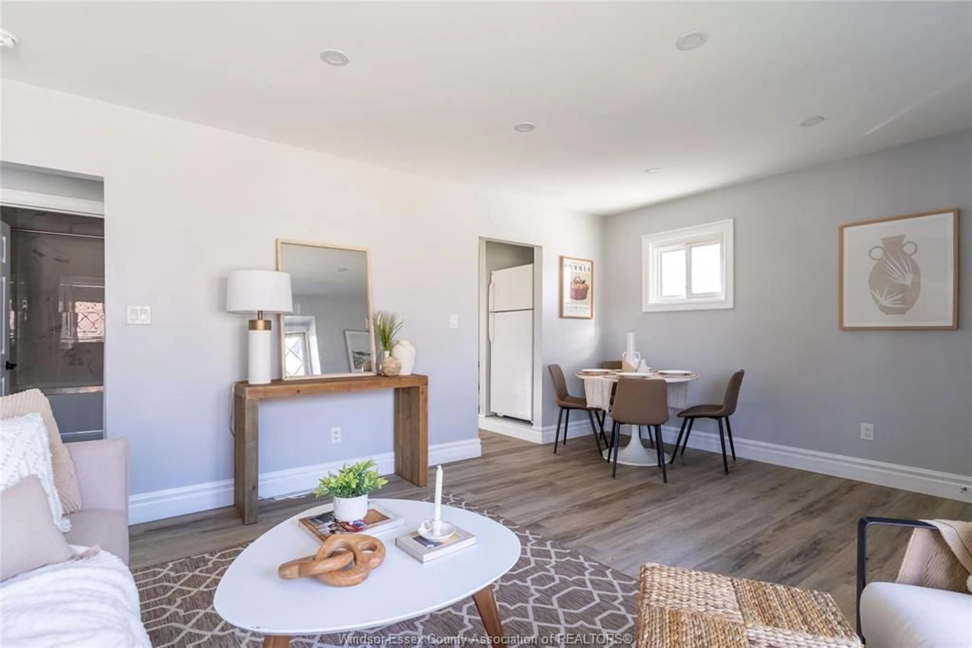 Living room with furniture, wood/laminate floor for 835 FRANCOIS Crt, Windsor Ontario N8Y 3W5