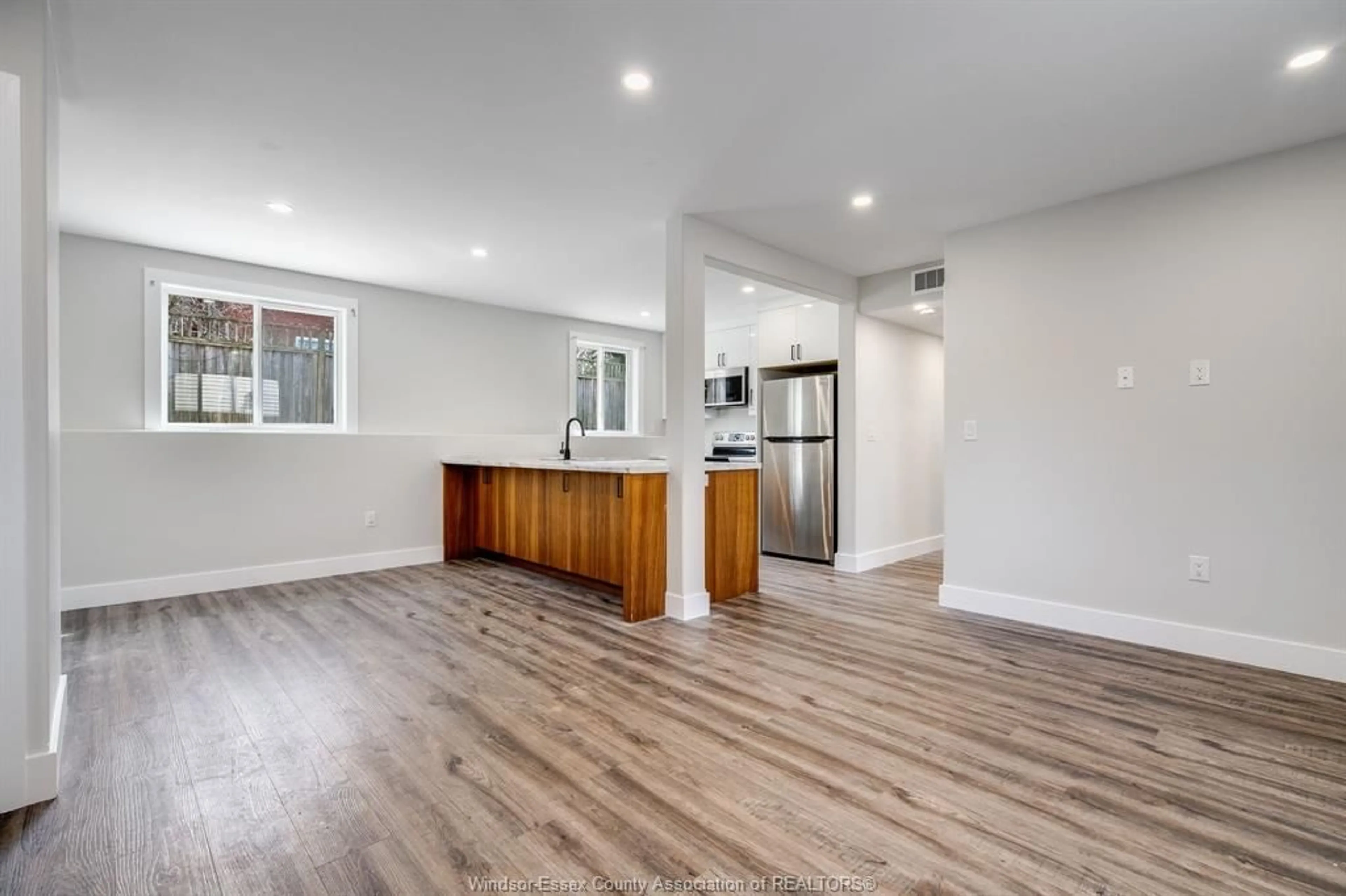 Open concept kitchen, wood/laminate floor for 36 Victoria Ave, Leamington Ontario N8H 2W6