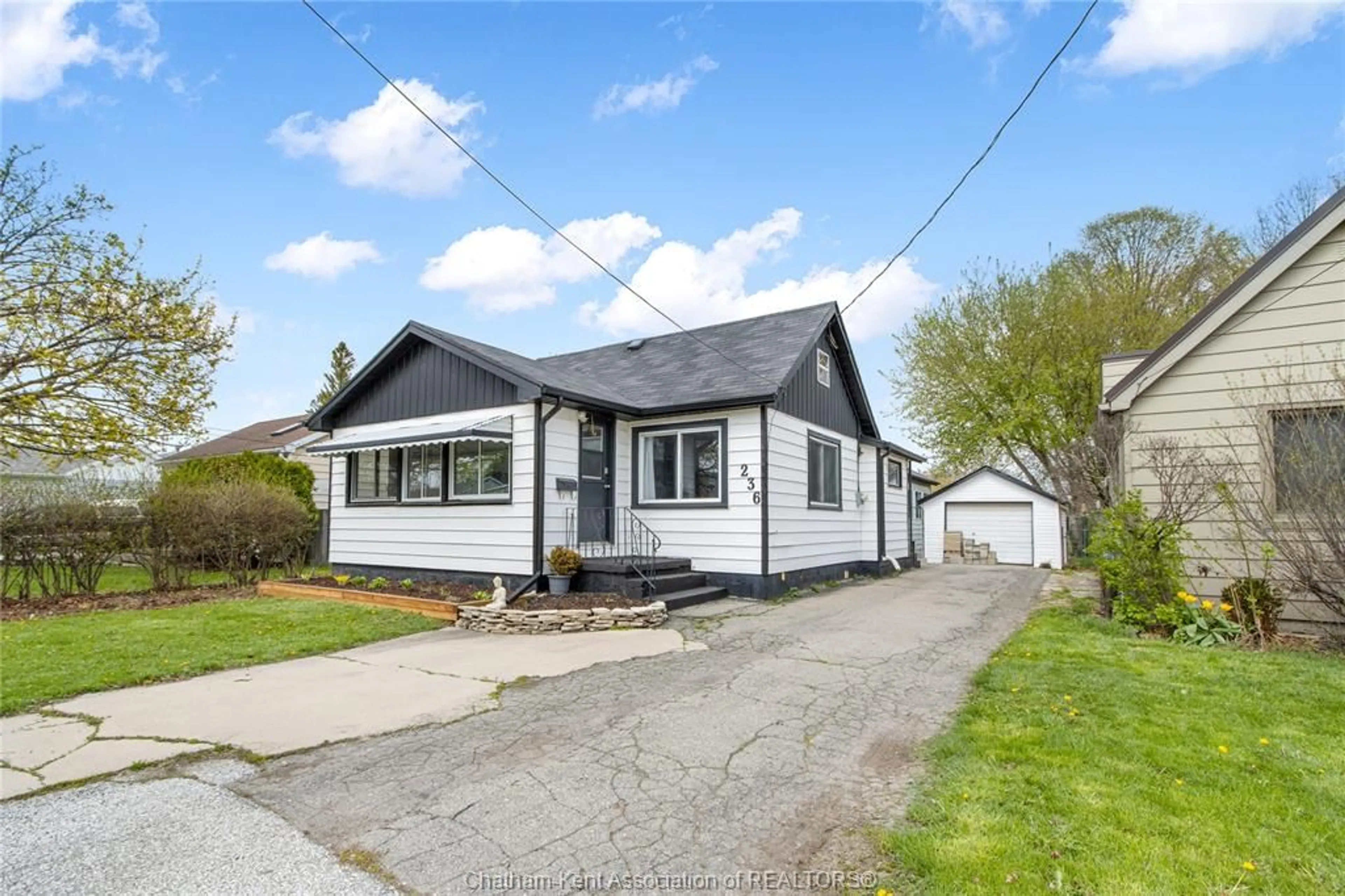 Home with vinyl exterior material, street for 236 SANDYS St, Chatham Ontario N7L 3P8