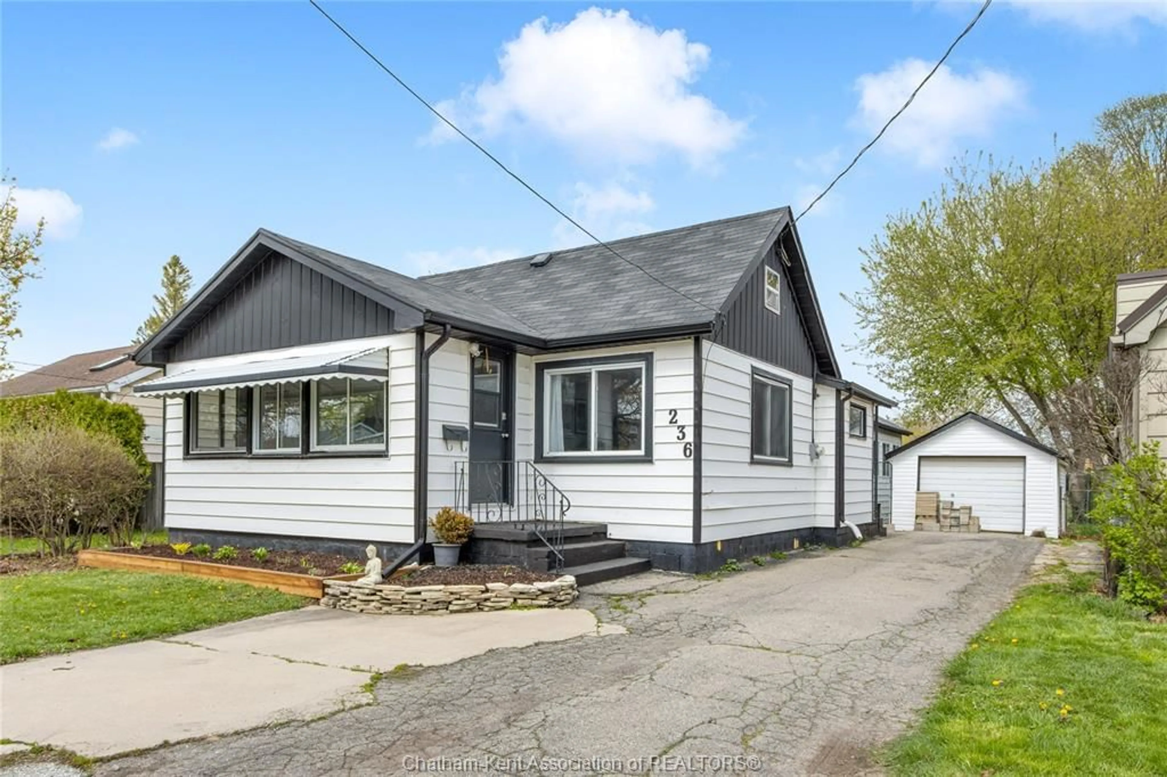 Home with vinyl exterior material, street for 236 SANDYS St, Chatham Ontario N7L 3P8