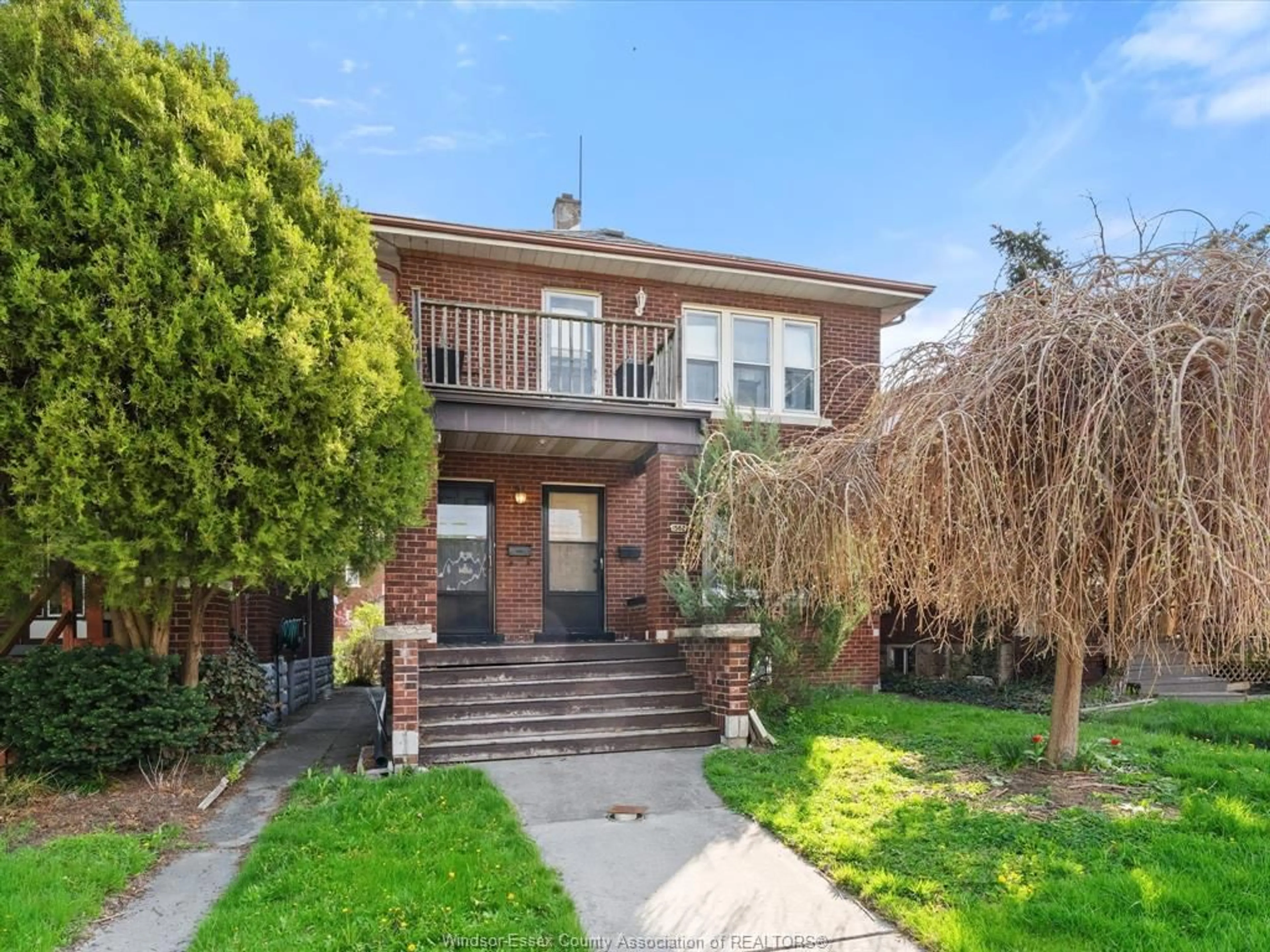 Home with brick exterior material, street for 1560-1562 DOUGALL Ave, Windsor Ontario N8X 1S1