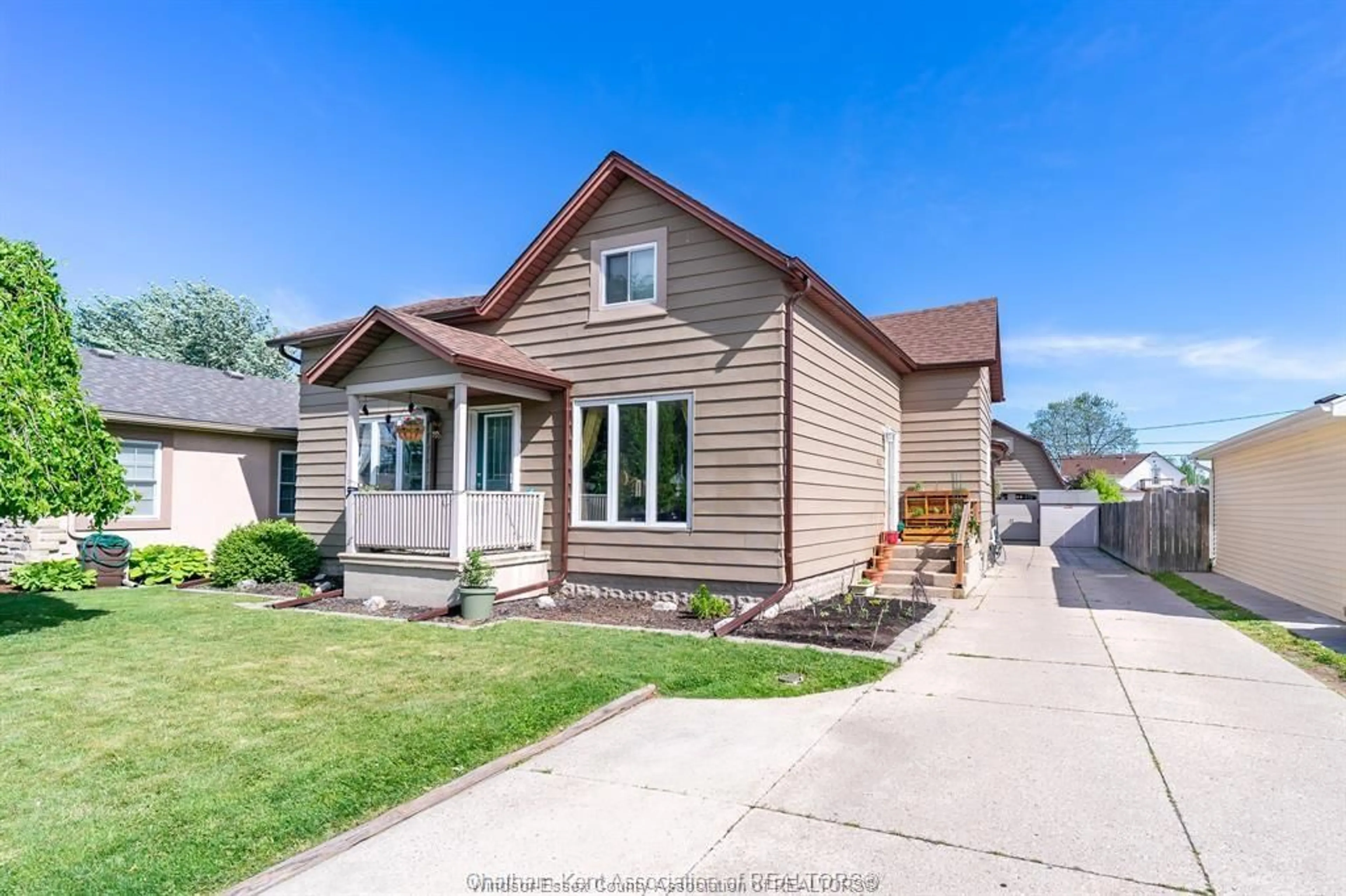 Home with vinyl exterior material, street for 12346-48 ARBOUR St, Tecumseh Ontario N8N 1P2