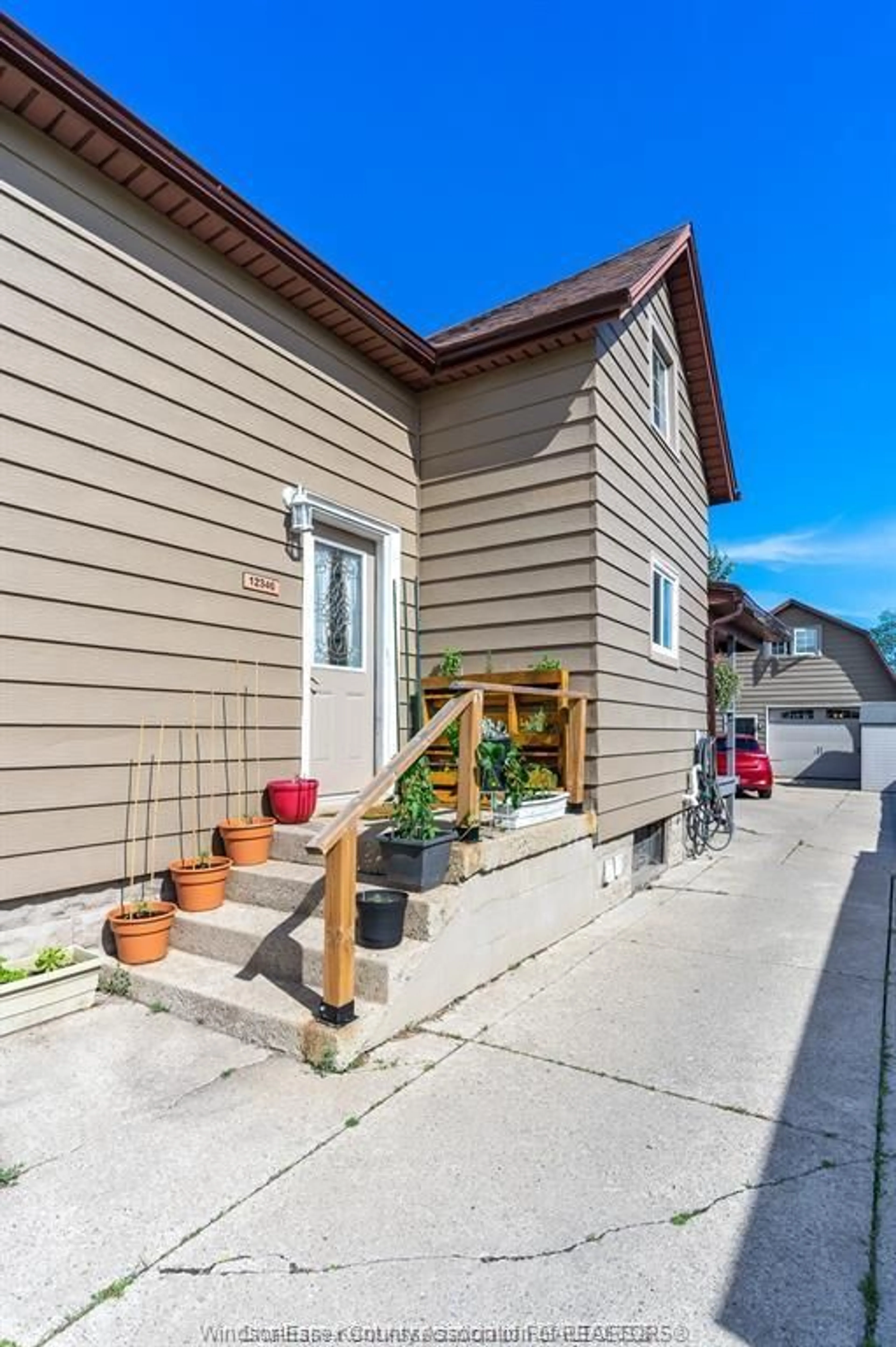 Home with vinyl exterior material, street for 12346-48 ARBOUR St, Tecumseh Ontario N8N 1P2