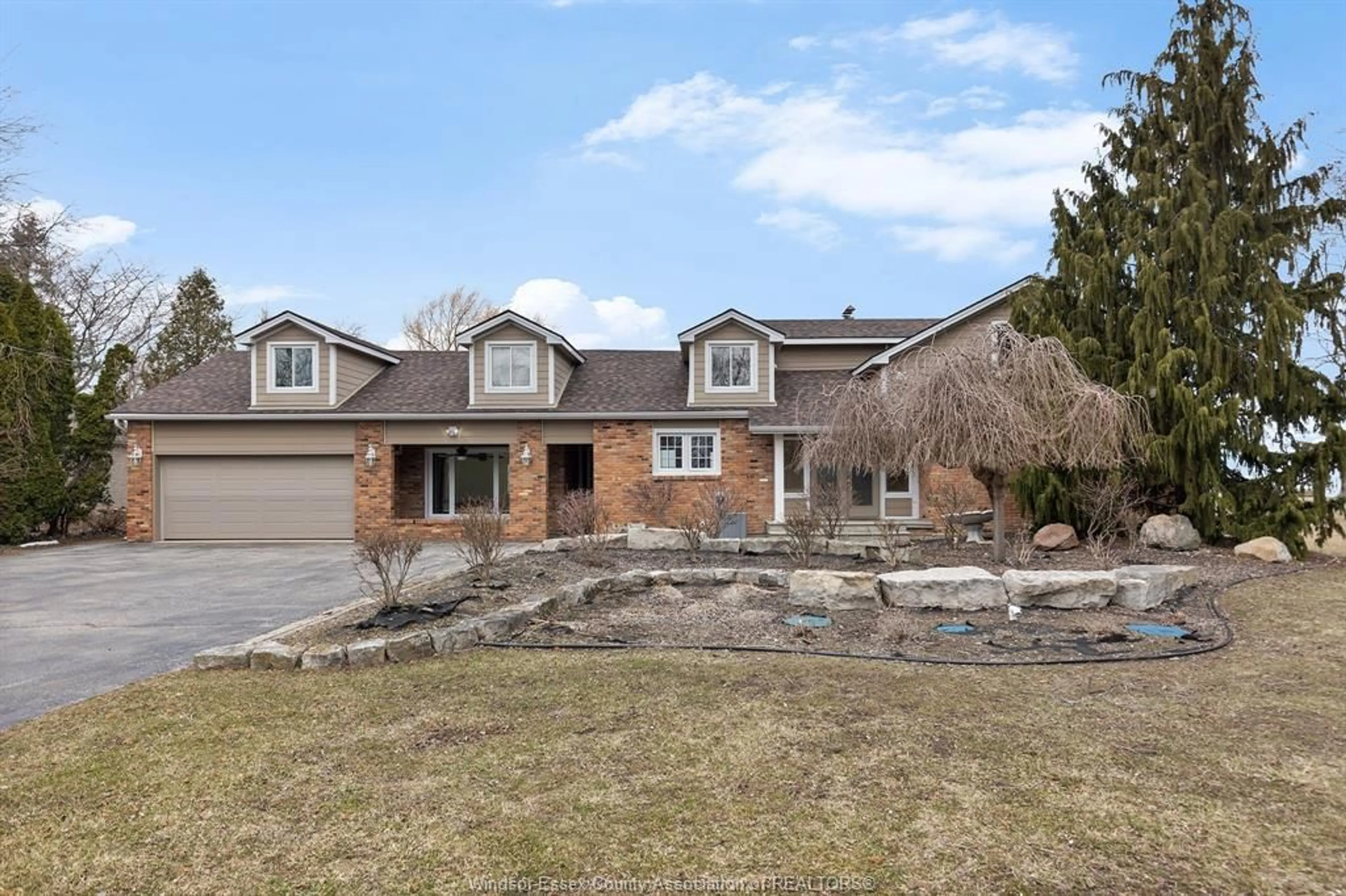 Home with brick exterior material, street for 1225 SURF CLUB Dr, Lakeshore Ontario N0R 1S0