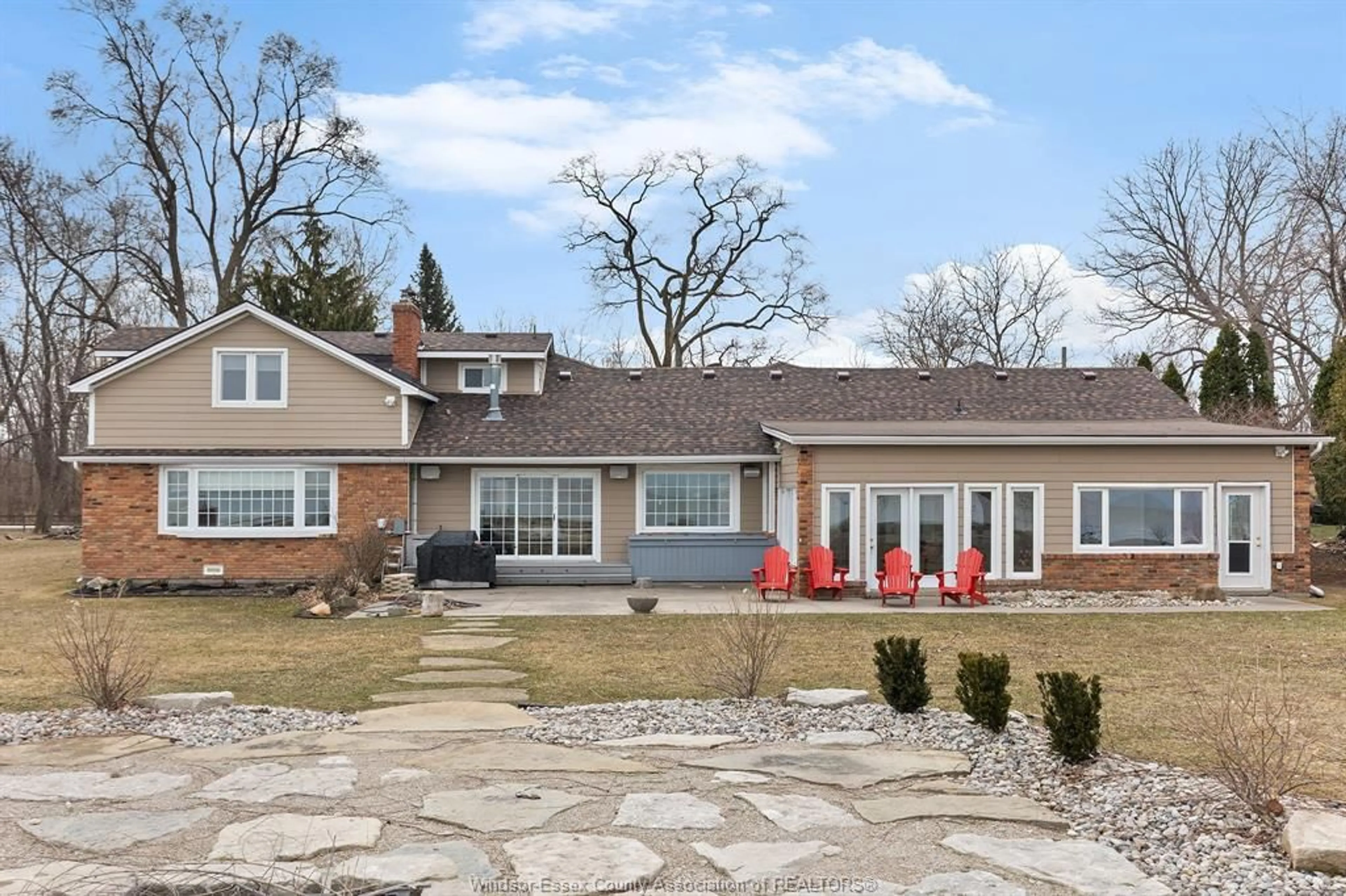 Home with brick exterior material, street for 1225 SURF CLUB Dr, Lakeshore Ontario N0R 1S0