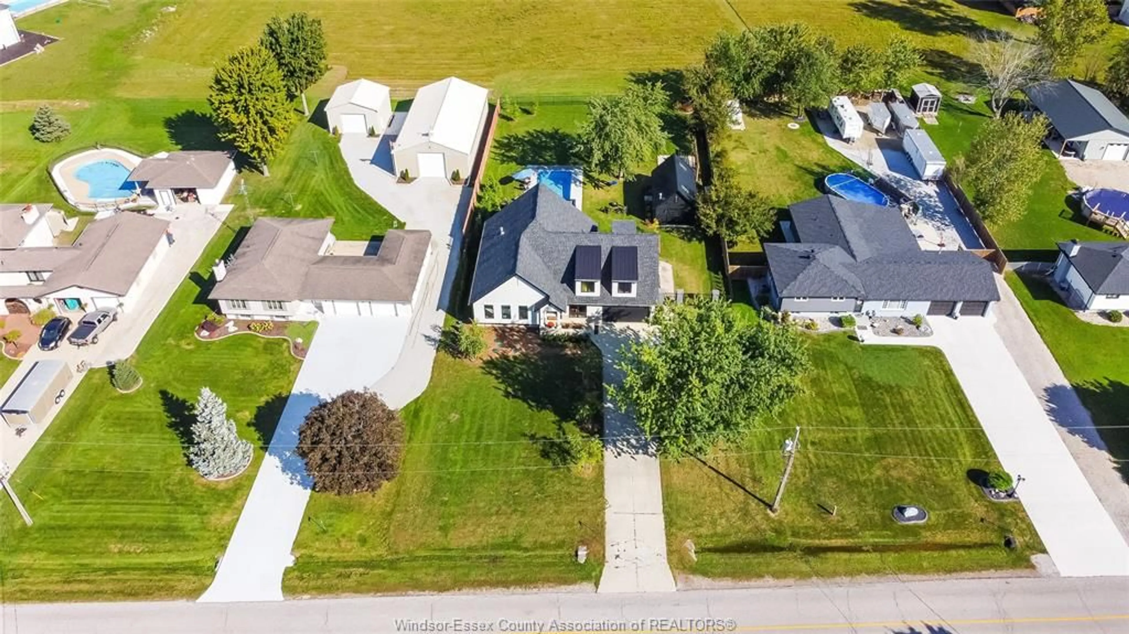 A pic from outside/outdoor area/front of a property/back of a property/a pic from drone, street for 77 BISSONNETTE Lane, Lakeshore Ontario N0R 1V0