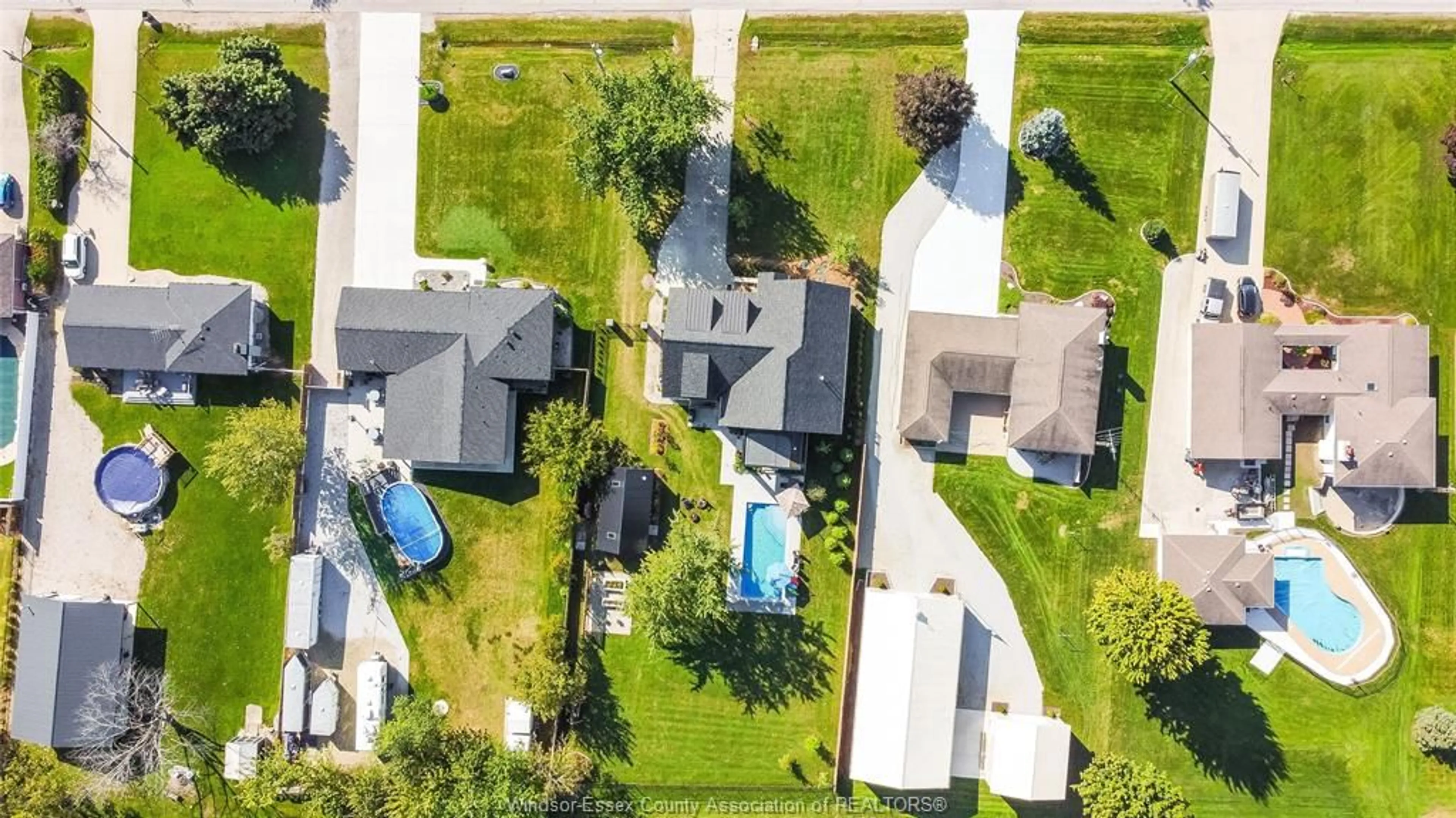 A pic from outside/outdoor area/front of a property/back of a property/a pic from drone, street for 77 BISSONNETTE Lane, Lakeshore Ontario N0R 1V0