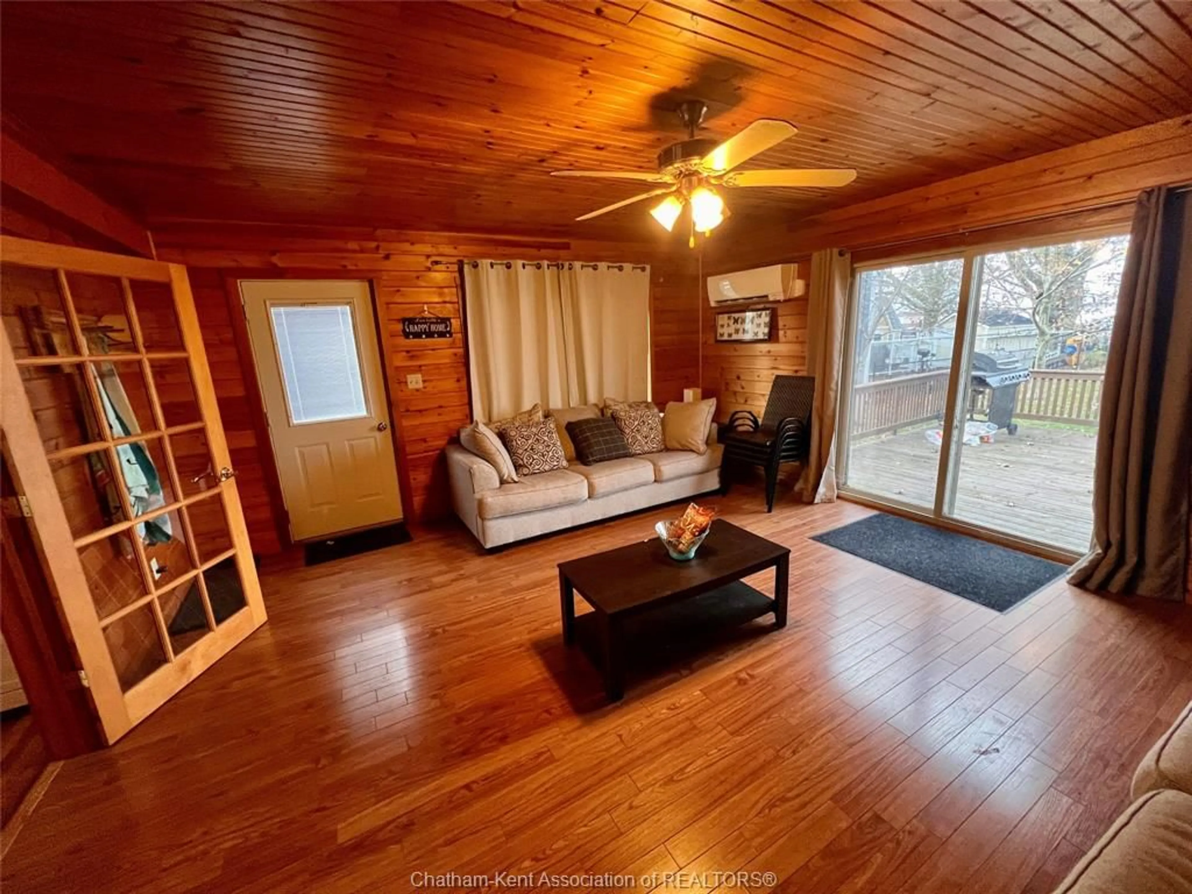 Living room with furniture, wood/laminate floor for 3 Stass Lane, Erieau Ontario N0P 1N0