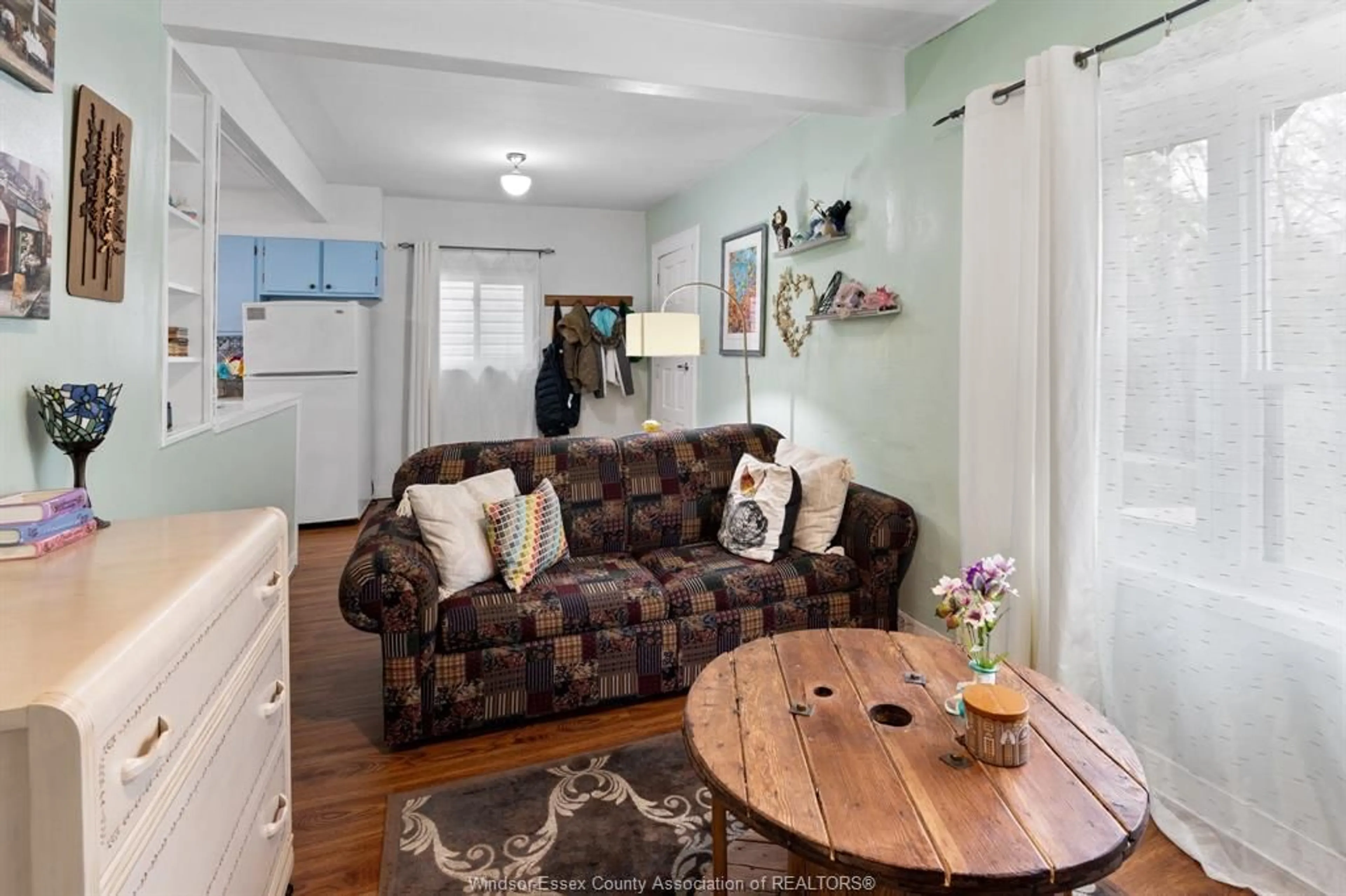 Living room with furniture, wood/laminate floor for 2256 CHURCH, Windsor Ontario N8X 1V9