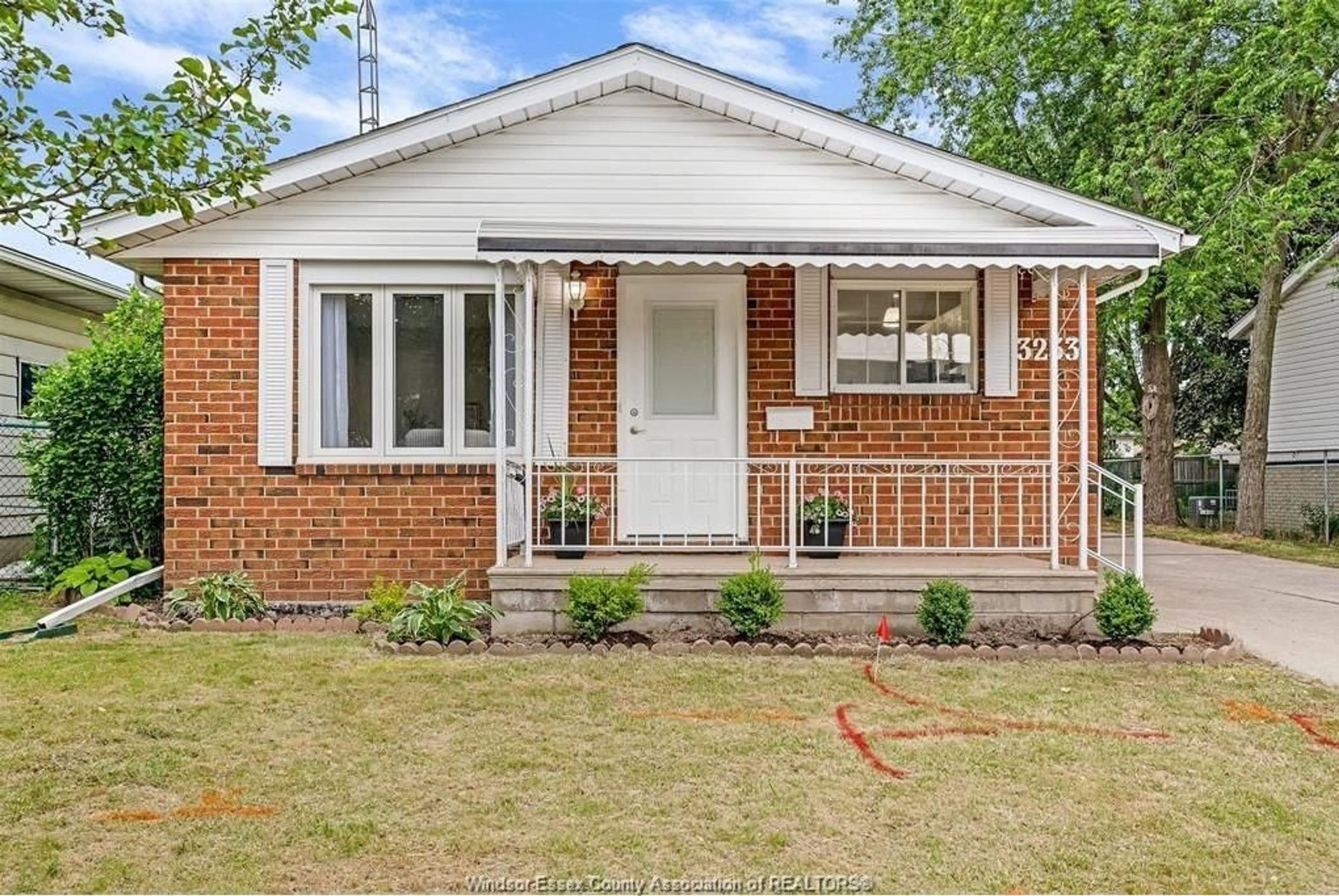 Home with brick exterior material, street for 3233 AURORA Dr, Windsor Ontario N8R 1Y9