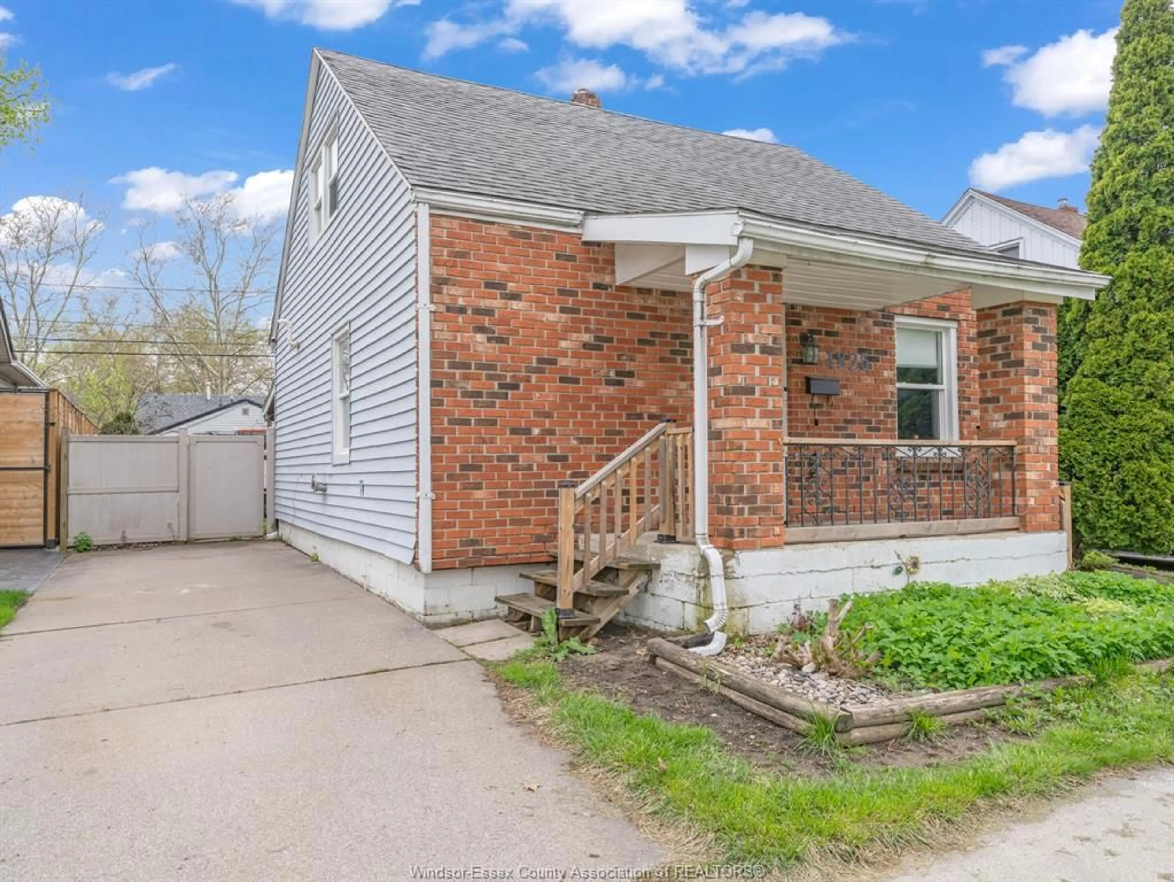 Home with brick exterior material, street for 1825 TOURANGEAU Rd, Windsor Ontario N8W 4N2