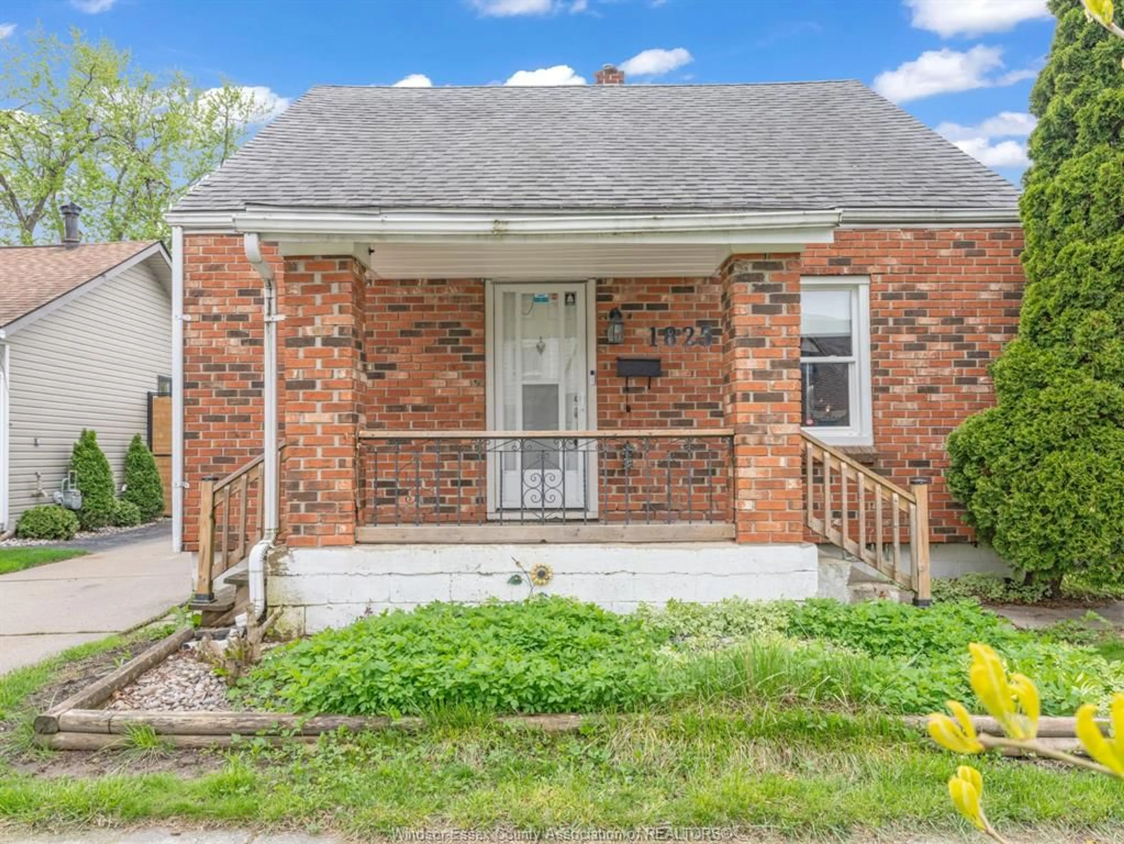 Home with brick exterior material, street for 1825 TOURANGEAU Rd, Windsor Ontario N8W 4N2