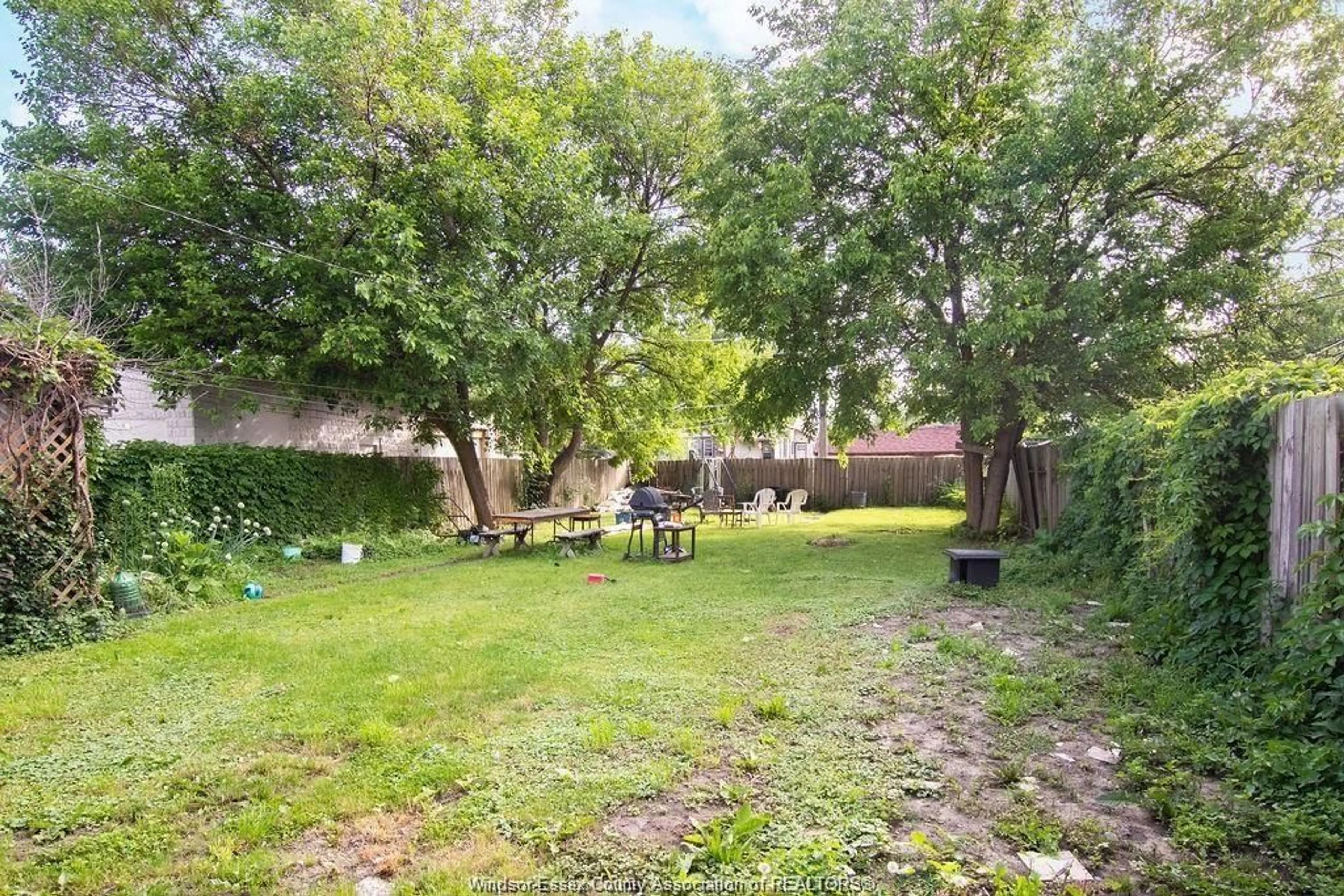 Patio, forest/trees view for 819 LANGLOIS Ave, Windsor Ontario N9A 2G9