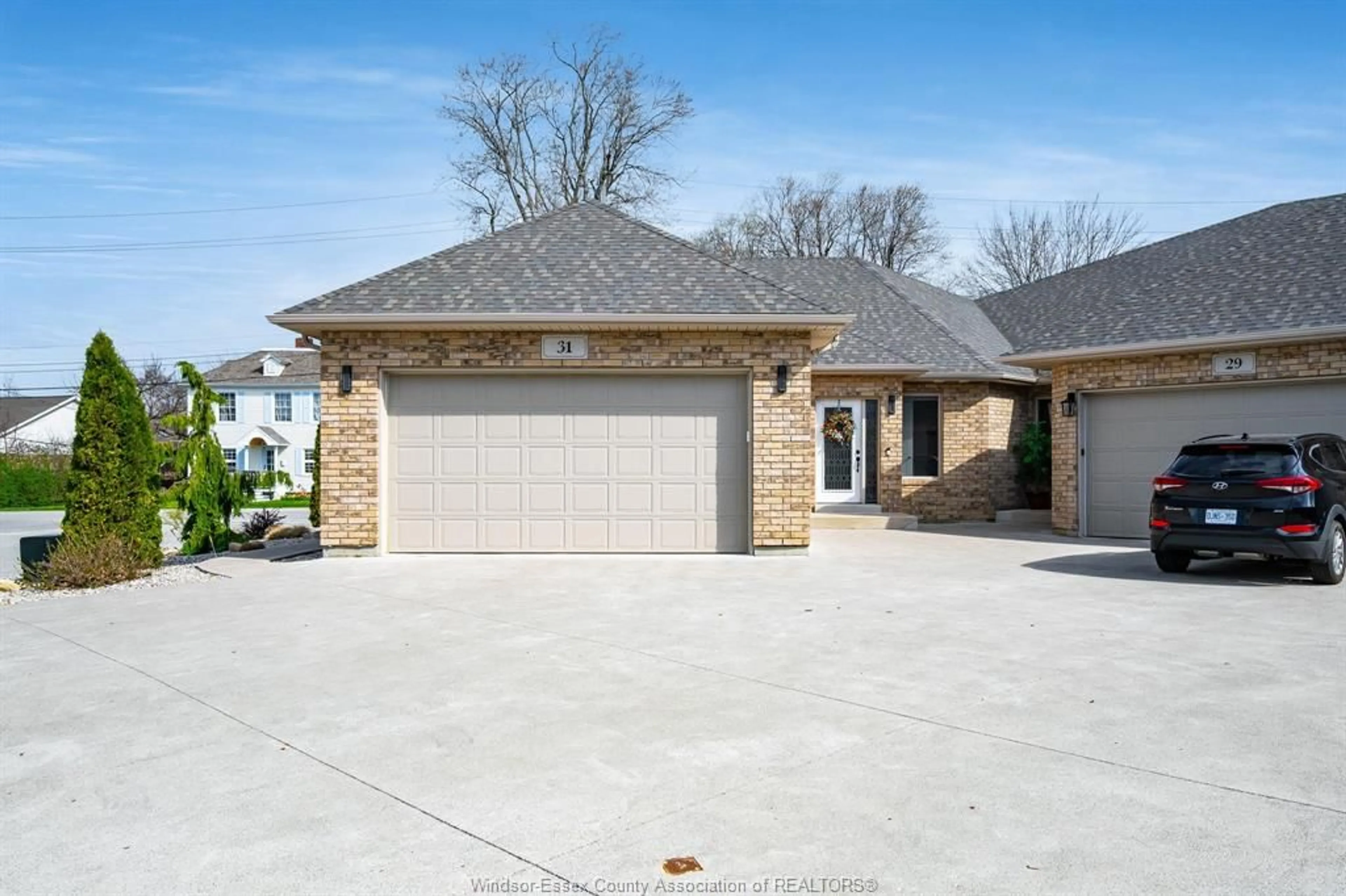 Home with brick exterior material, street for 31 Mettawas Lane, Kingsville Ontario N9Y 2C9