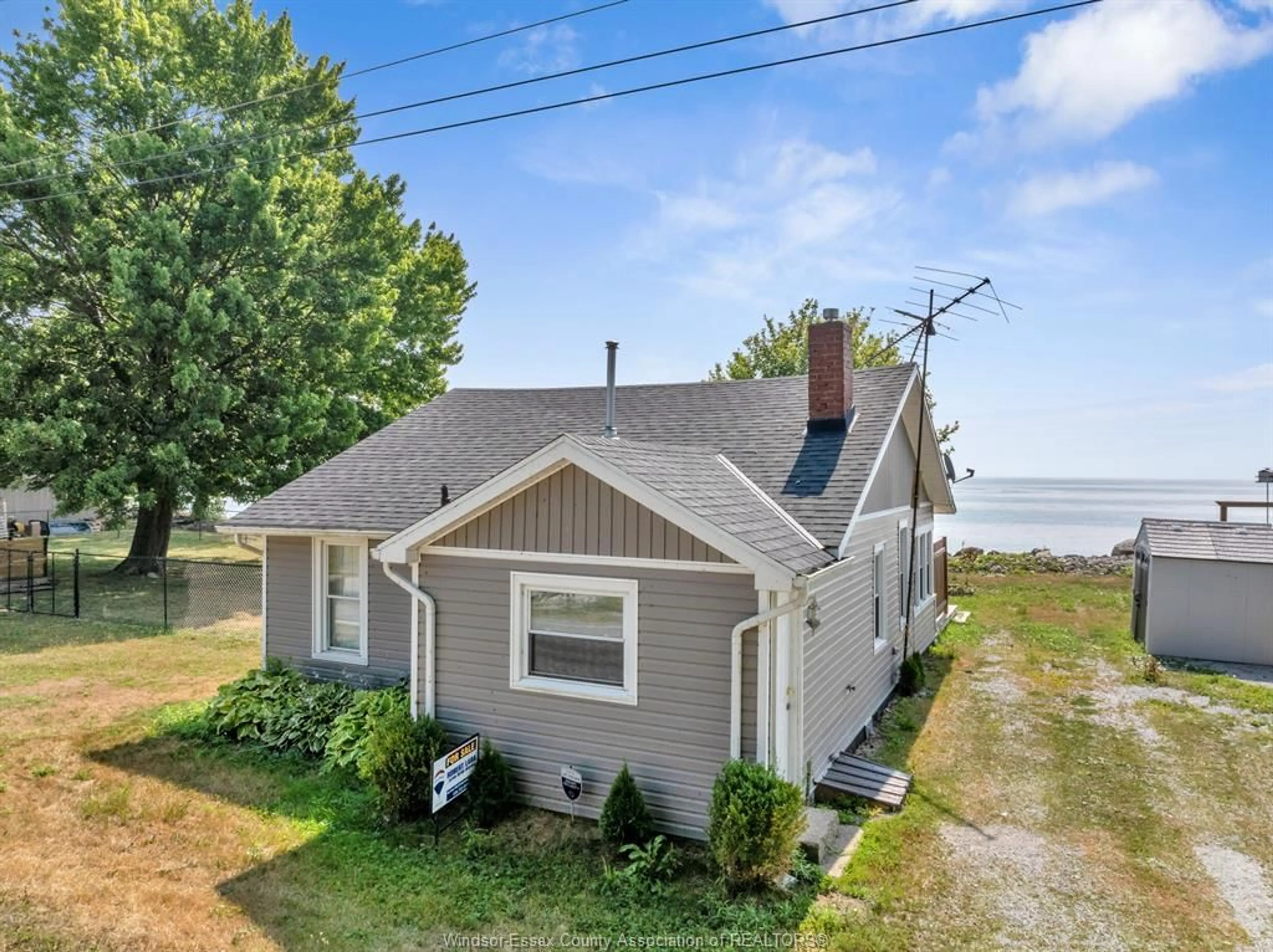 A pic from outside/outdoor area/front of a property/back of a property/a pic from drone, water/lake/river/ocean view for 32 PULLEY Rd, Leamington Ontario N0P 2P0