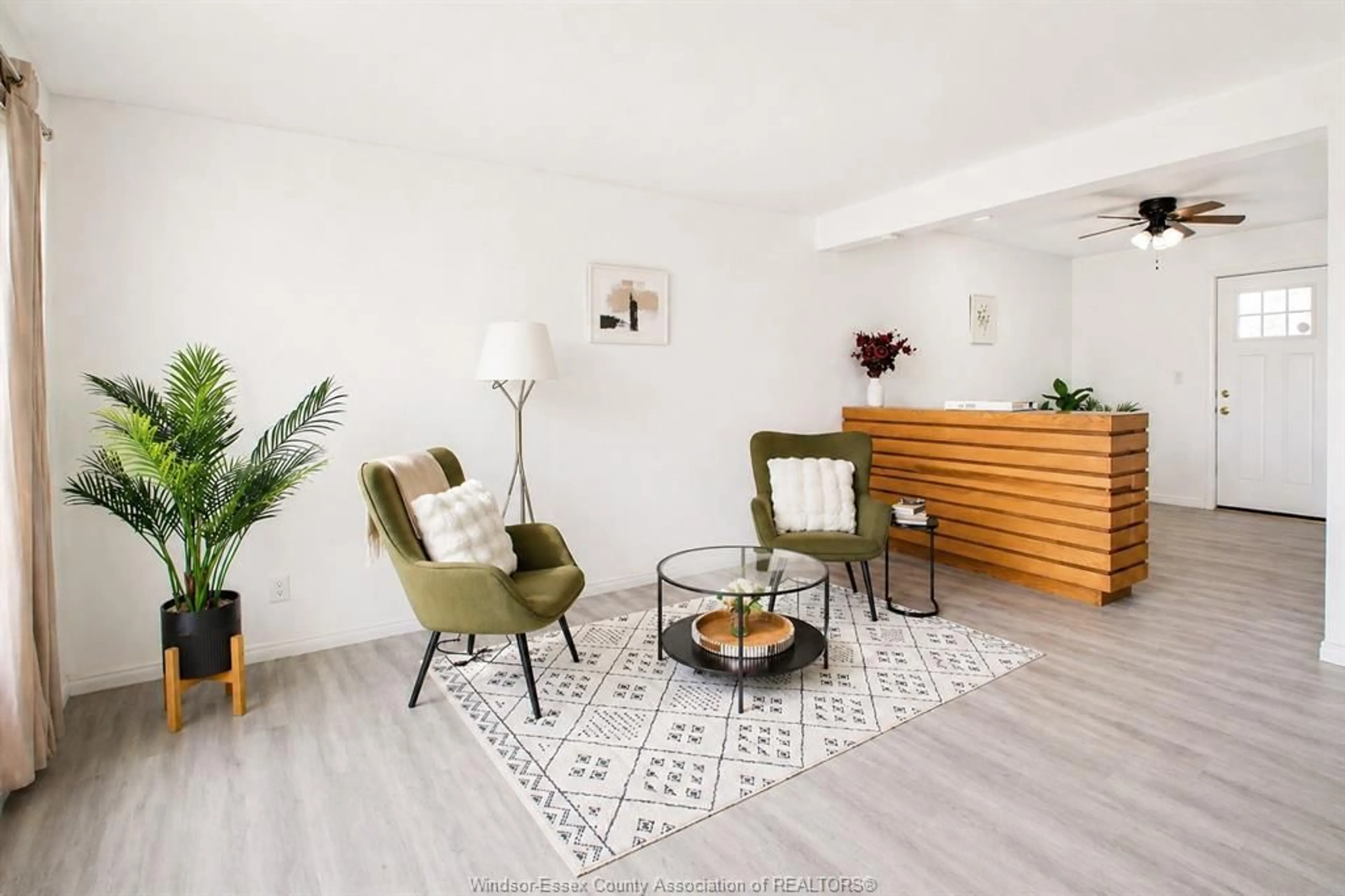 Living room with furniture, wood/laminate floor for 206-208 Arthur St, Harrow Ontario N0R 1G0