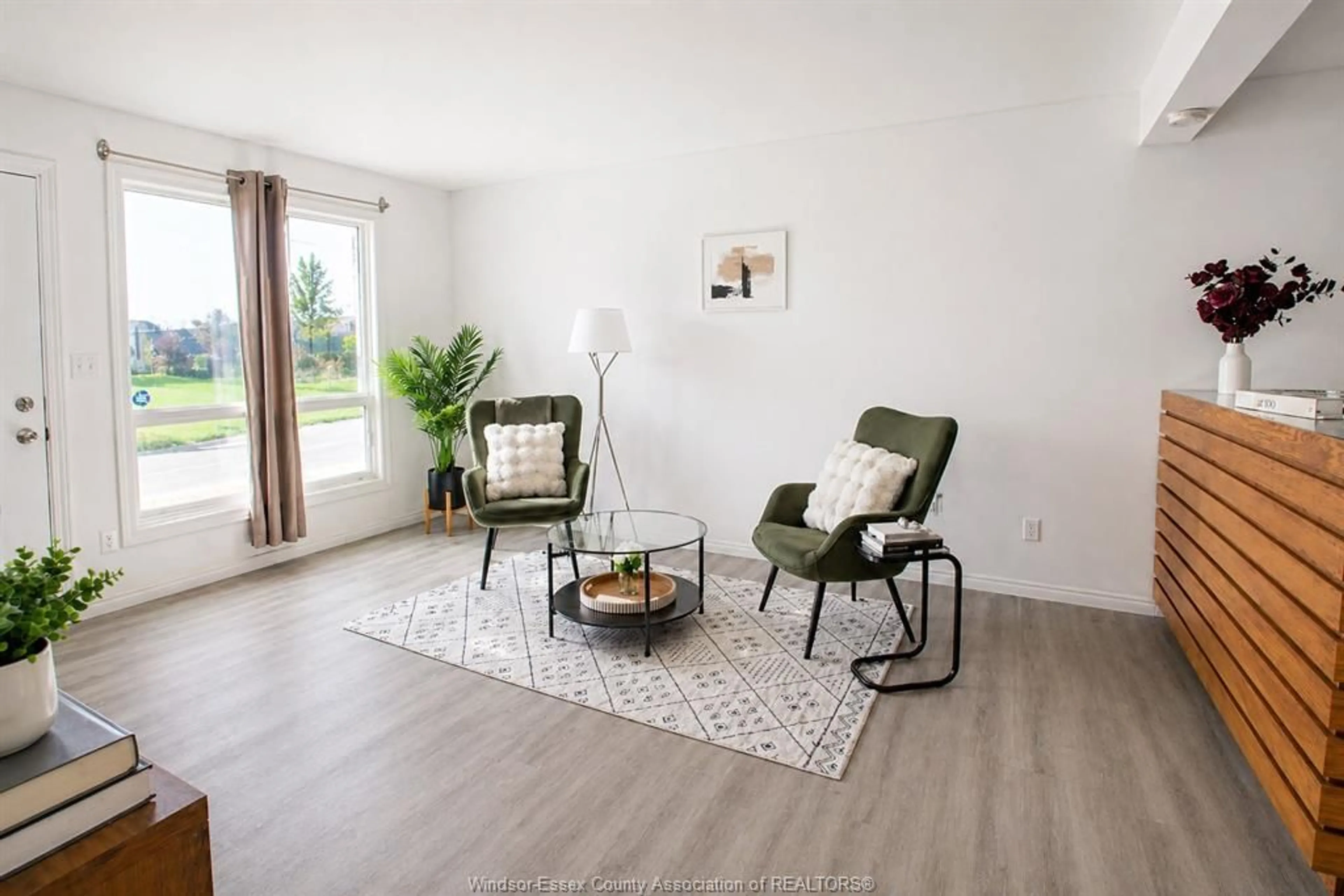 Living room with furniture, wood/laminate floor for 206-208 Arthur St, Harrow Ontario N0R 1G0