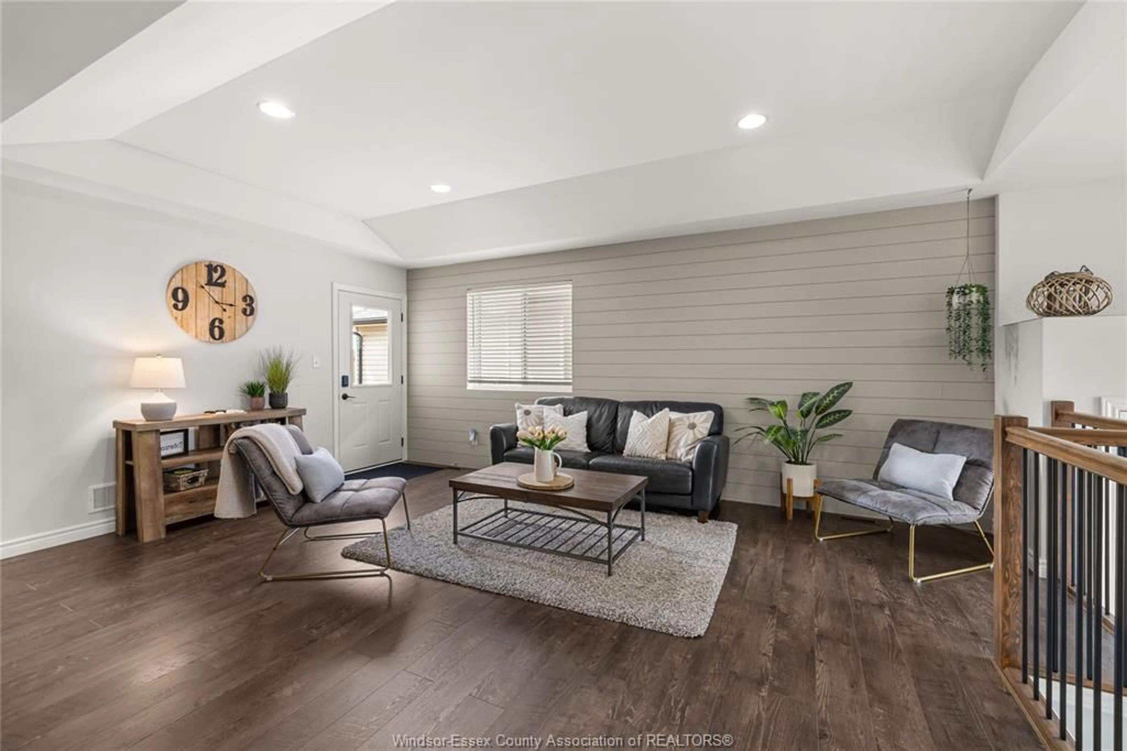 Living room with furniture, wood/laminate floor for 3117 VIOLA Cres, Windsor Ontario N8N 0A1