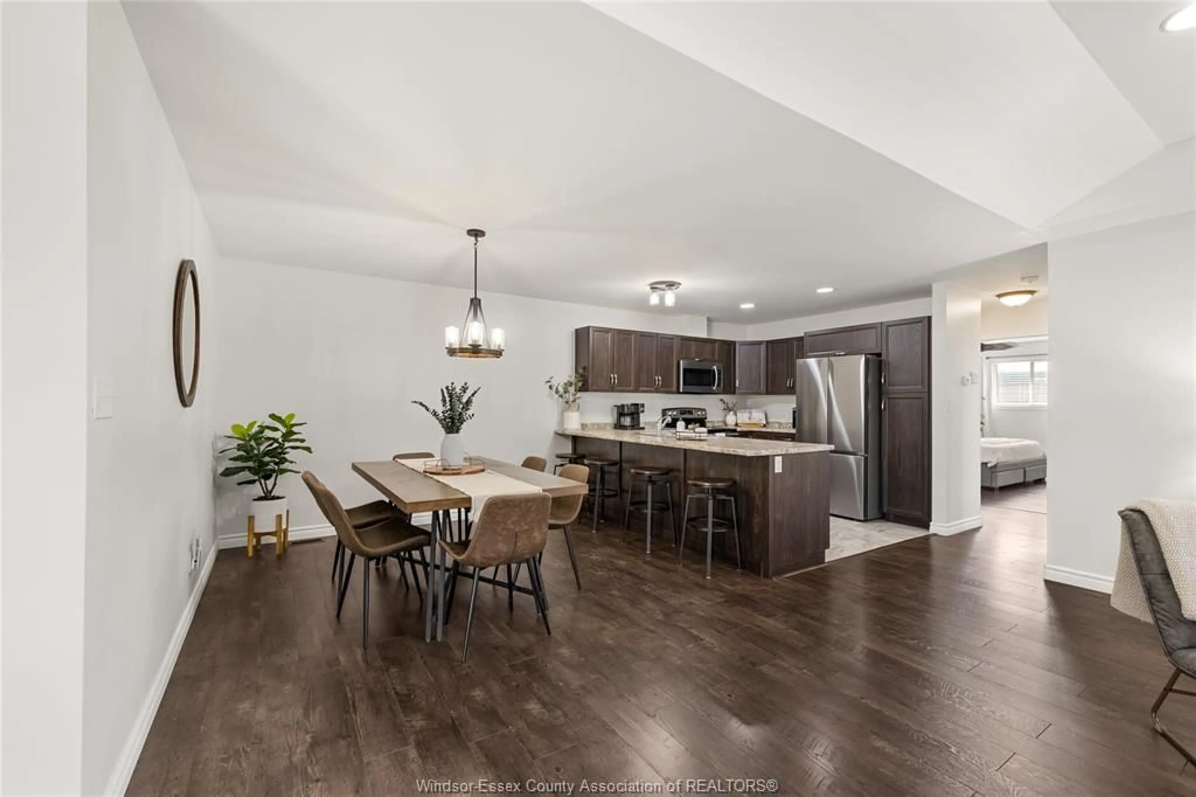 Open concept kitchen, wood/laminate floor for 3117 VIOLA Cres, Windsor Ontario N8N 0A1