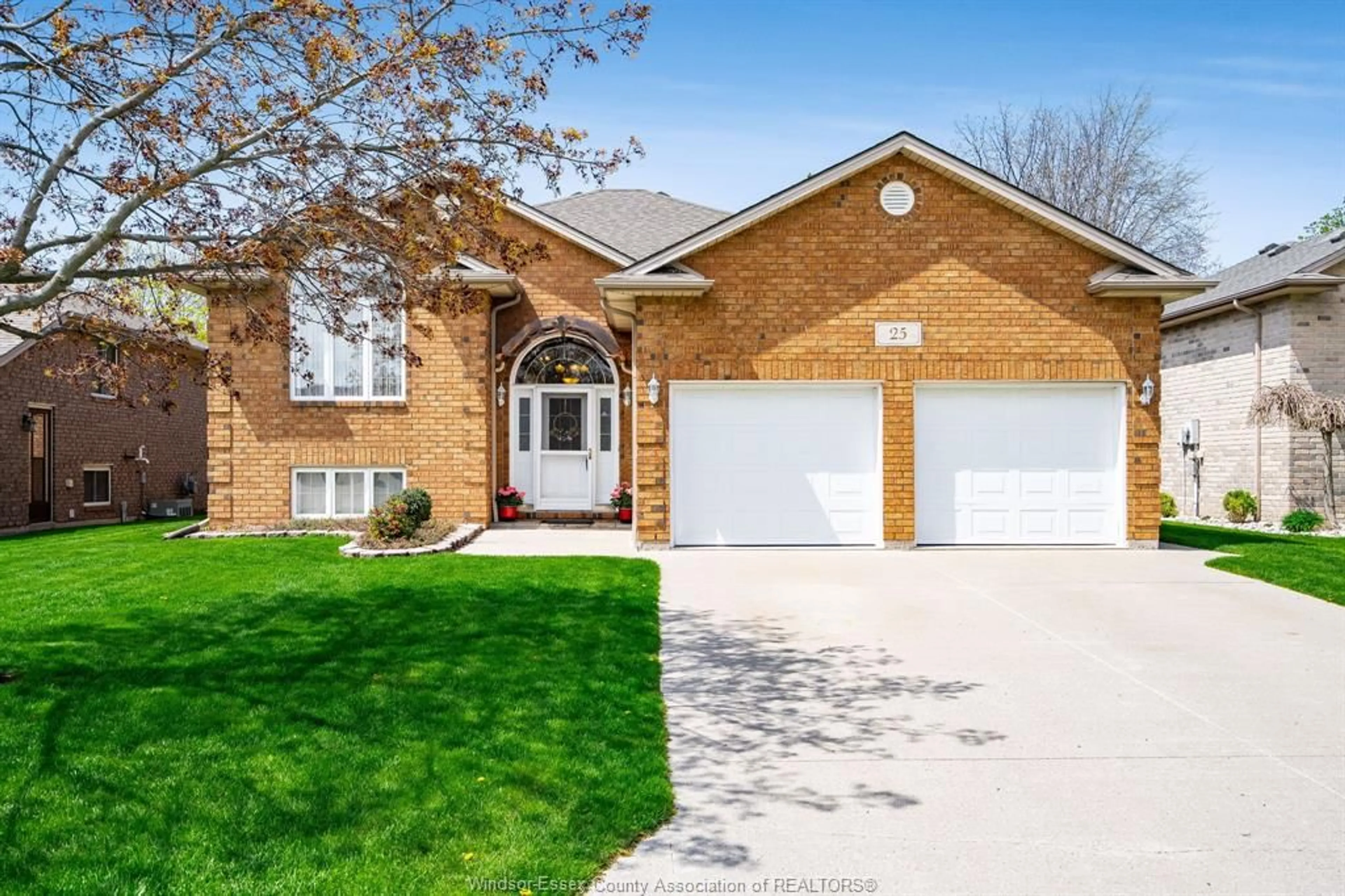Home with brick exterior material, street for 25 Regatta Dr, Leamington Ontario N8H 5L6